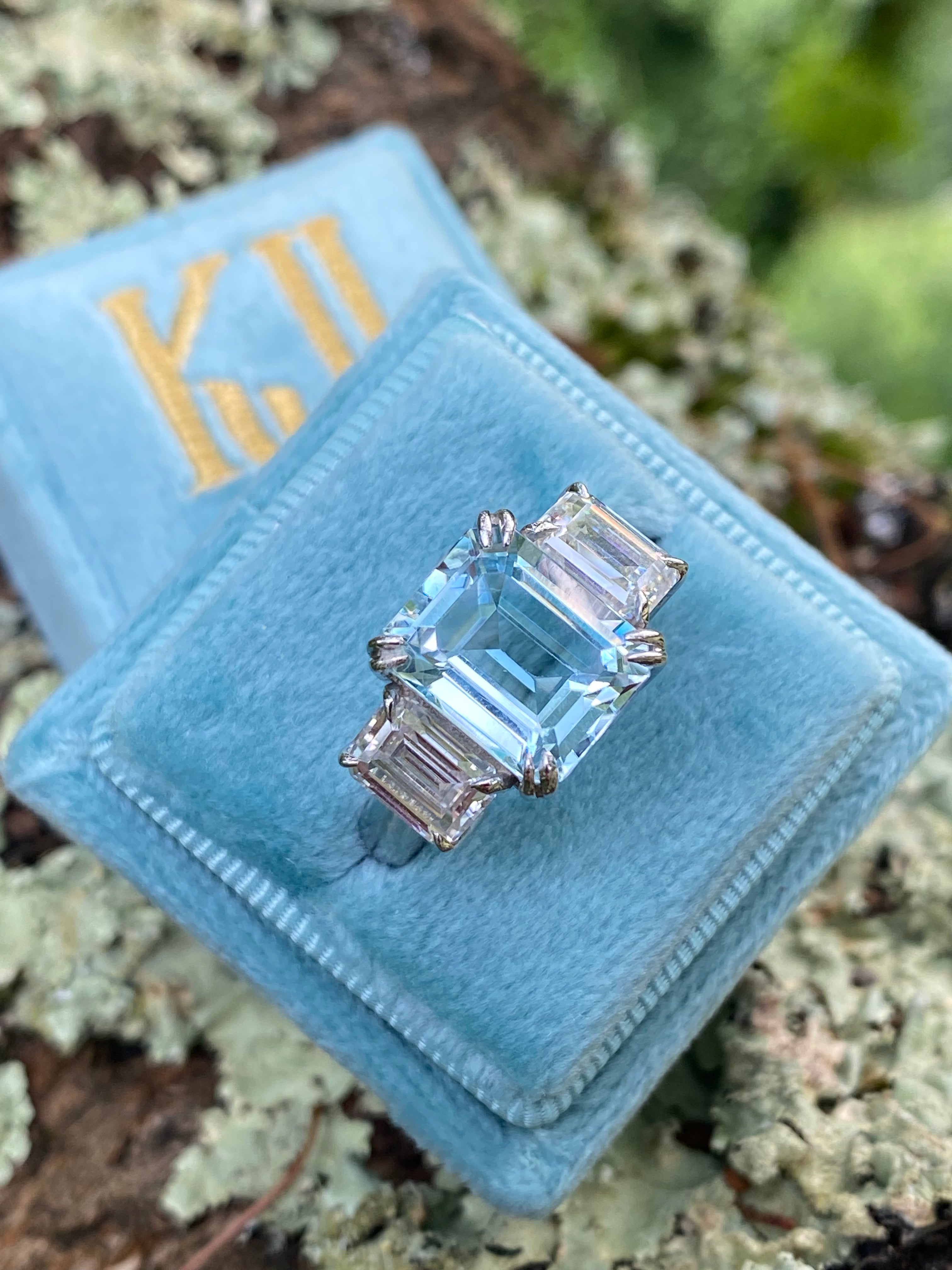 5.71 Carat Emerald Cut Blue Topaz and 2.00 Carat Moissanite Three Stone Ring in Sterling Silver