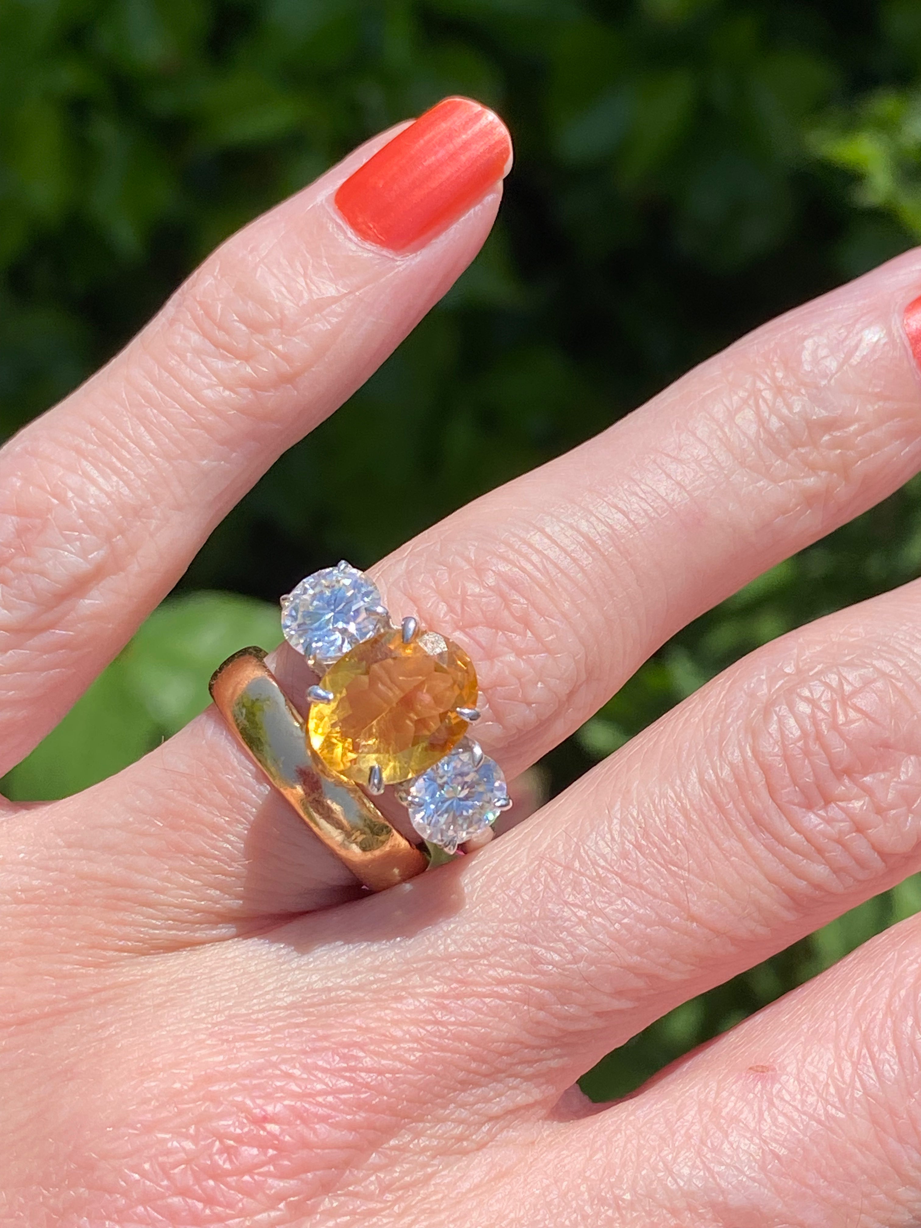 2.66 Carat Oval Cut Citrine and 1.85 Carat Moissanite Three Stone Ring in Sterling Silver