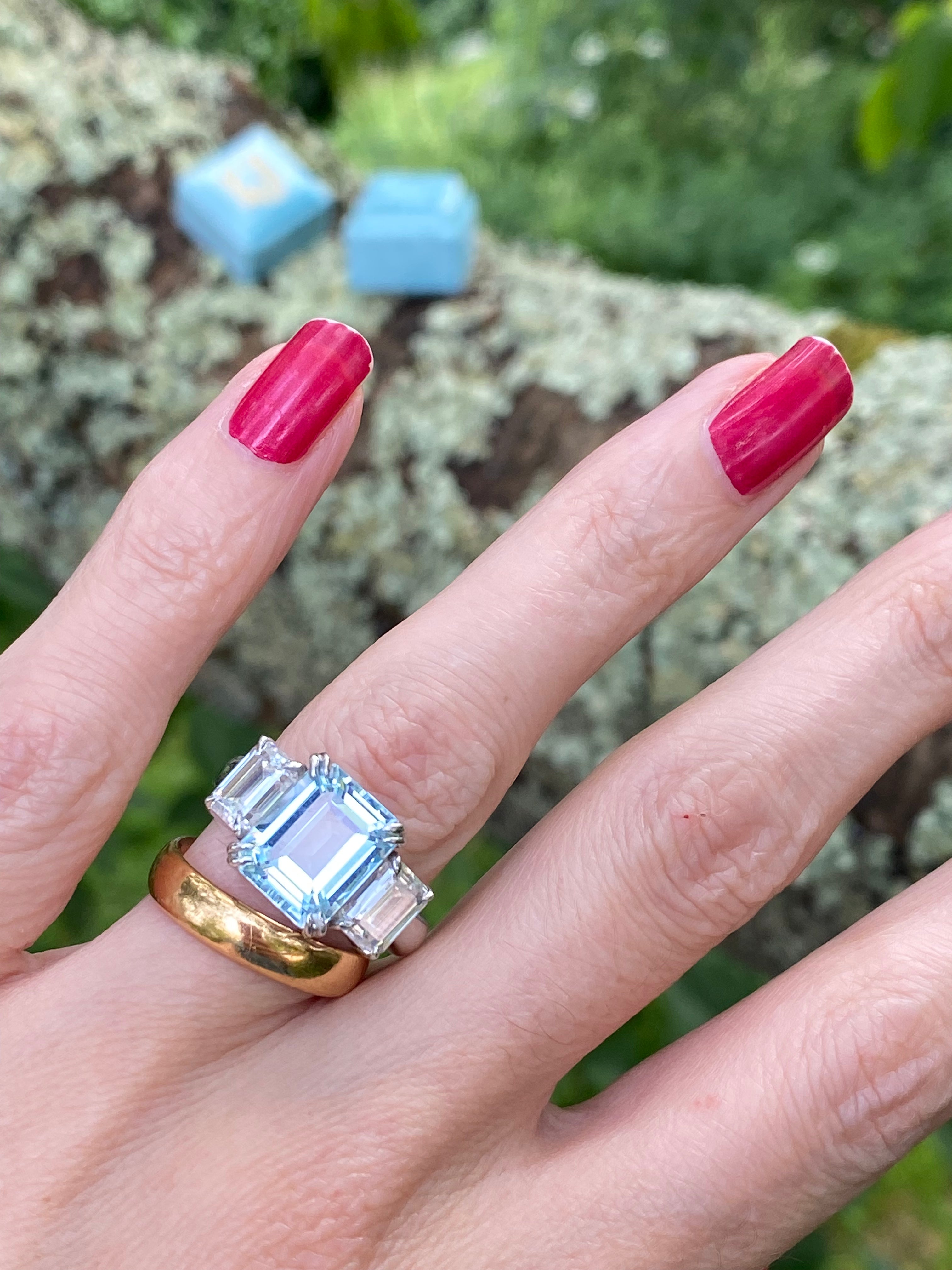 5.71 Carat Emerald Cut Blue Topaz and 2.00 Carat Moissanite Three Stone Ring in Sterling Silver