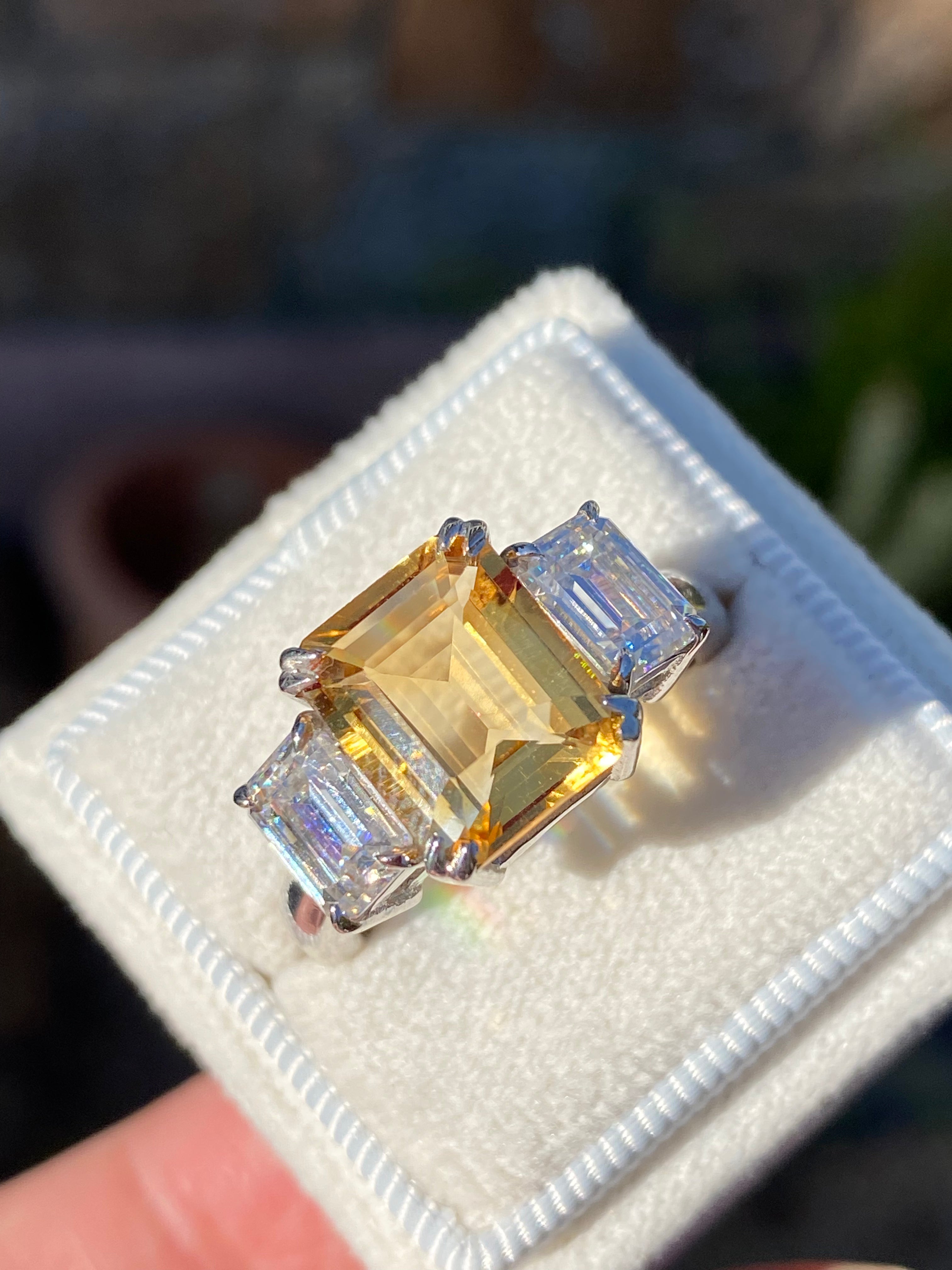 3.83 Carat Emerald Cut Citrine and 1.20 Carat Moissanite Three Stone Ring in Sterling Silver