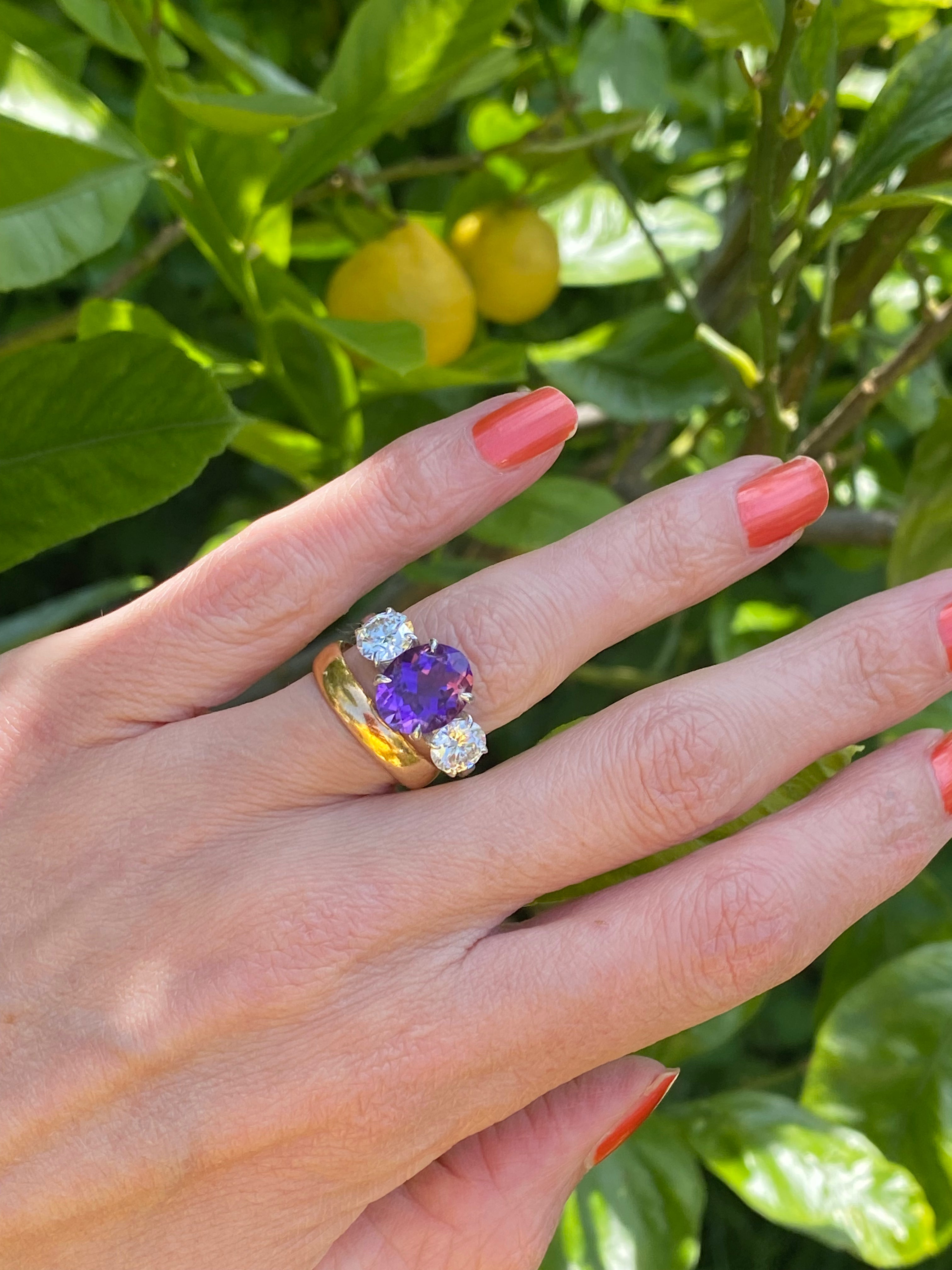 3.42 Carat Oval Cut Amethyst and 1.85 Carat Moissanite Three Stone Ring in Sterling Silver