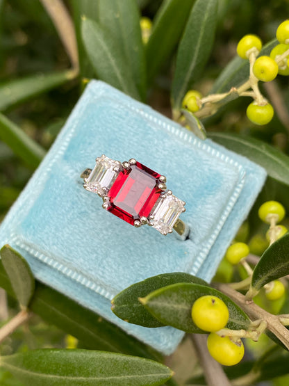3.50 CTW Emerald Cut Garnet and Moissanite Three Stone Ring in Sterling Silver