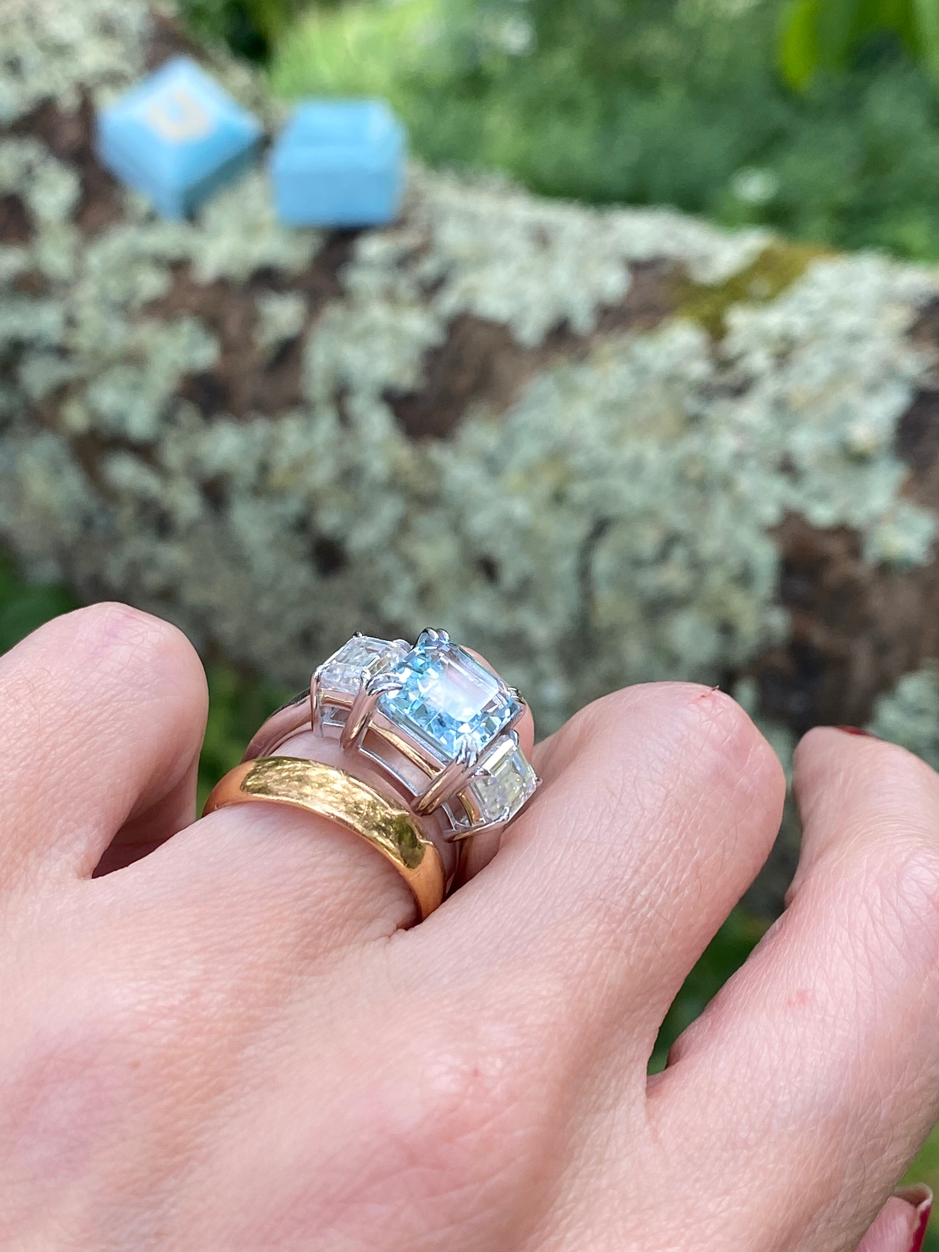 5.71 Carat Emerald Cut Blue Topaz and 2.00 Carat Moissanite Three Stone Ring in Sterling Silver