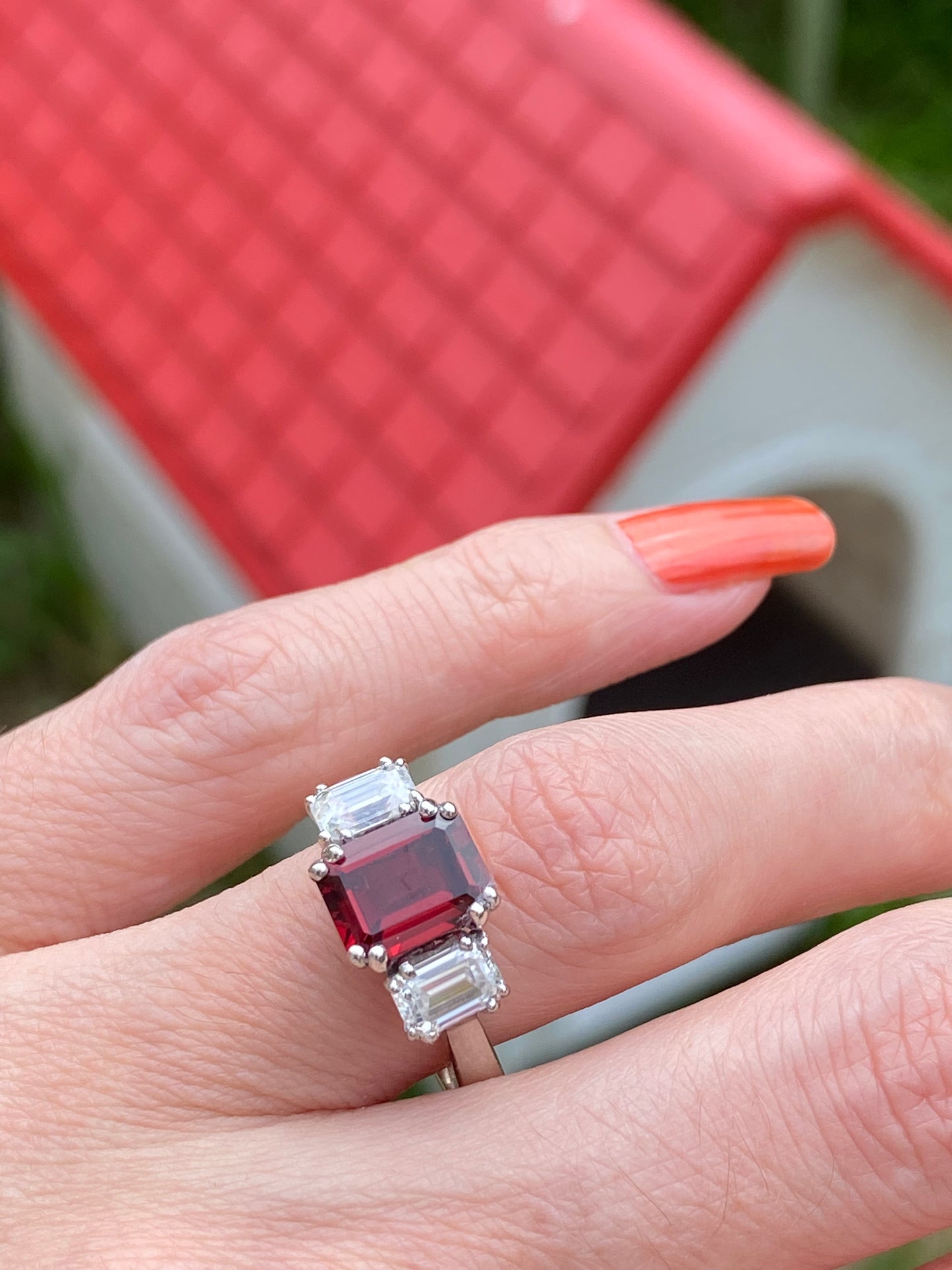 3.50 CTW Emerald Cut Garnet and Moissanite Three Stone Ring in Sterling Silver