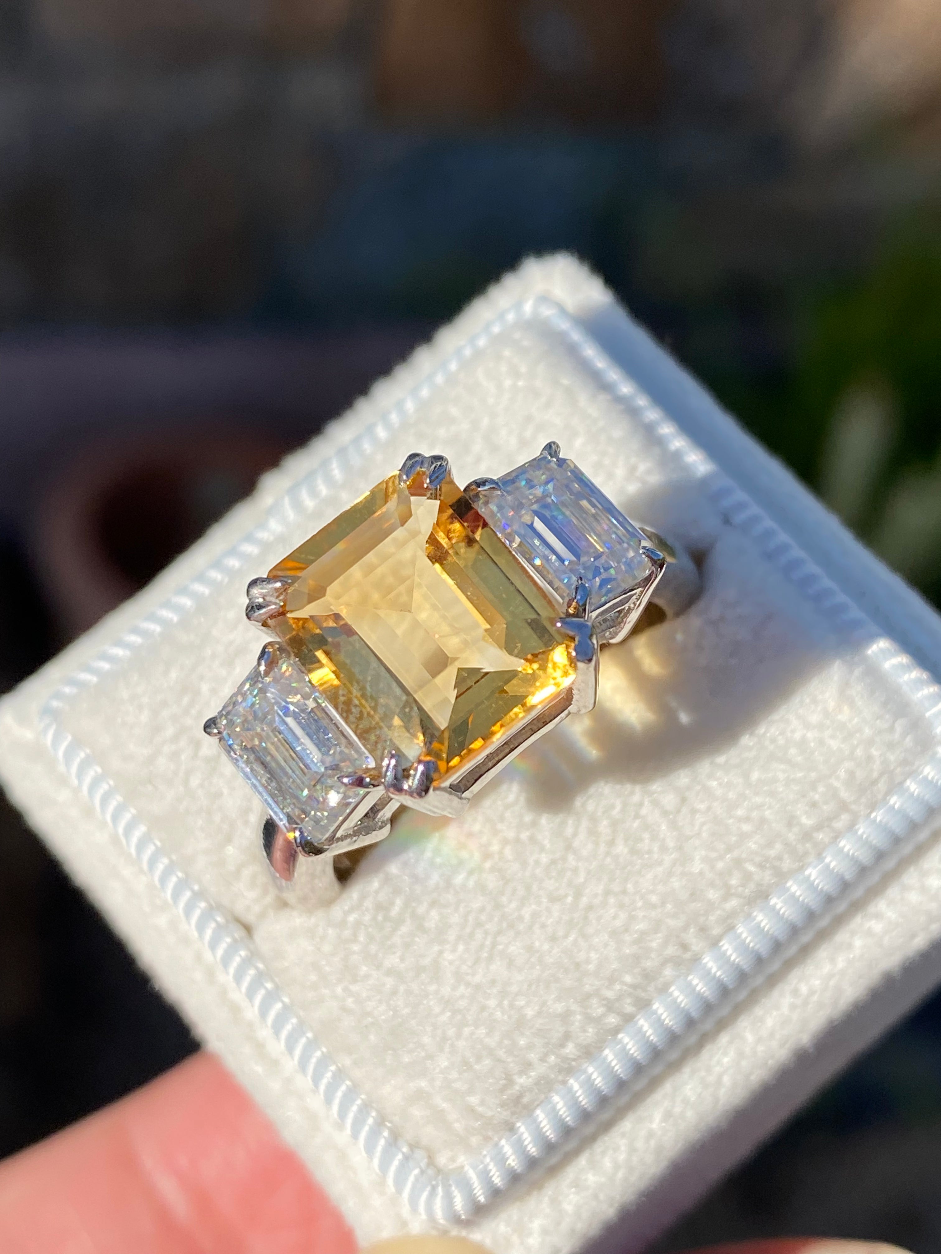 3.83 Carat Emerald Cut Citrine and 1.20 Carat Moissanite Three Stone Ring in Sterling Silver