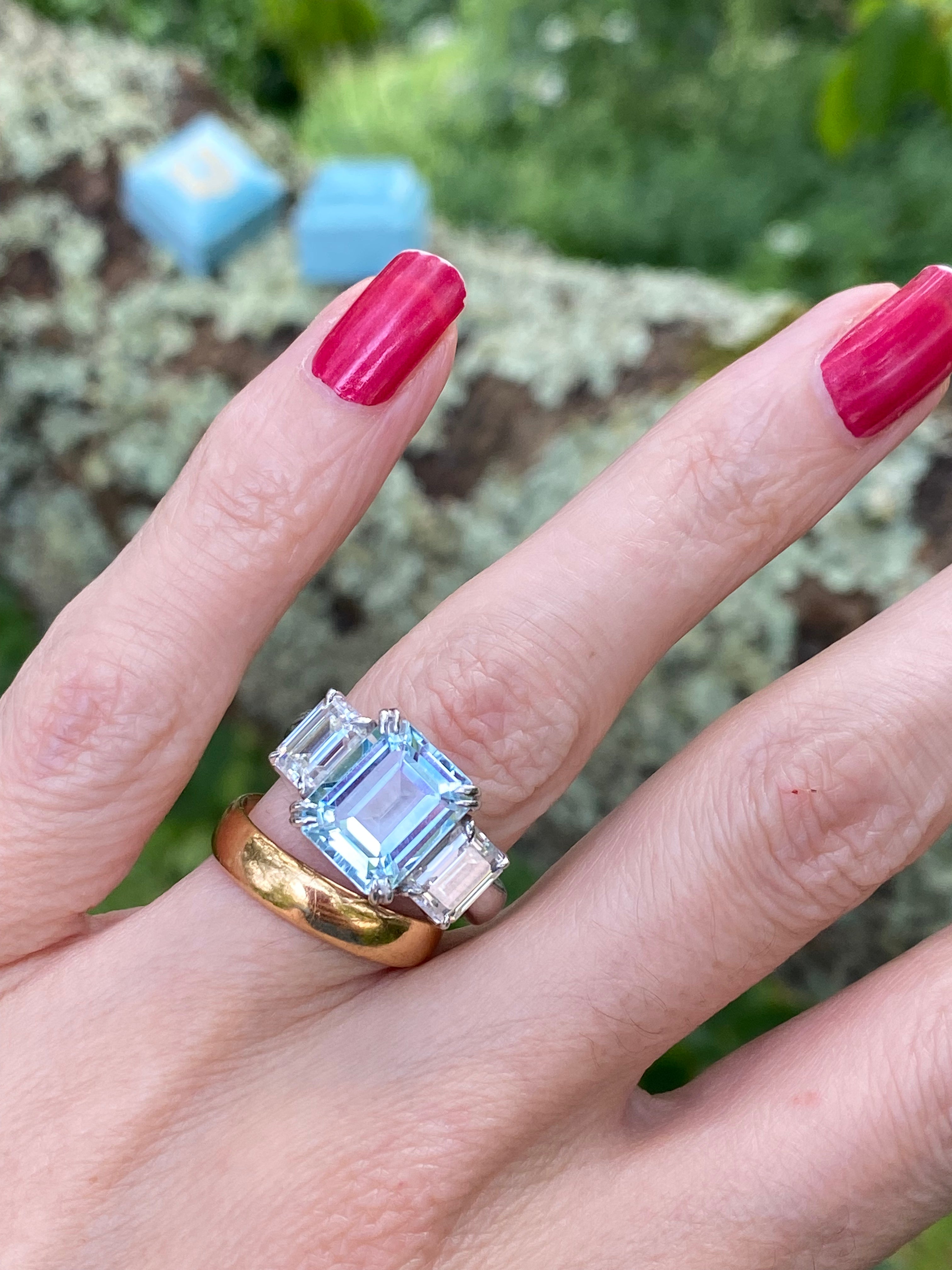 5.71 Carat Emerald Cut Blue Topaz and 2.00 Carat Moissanite Three Stone Ring in Sterling Silver