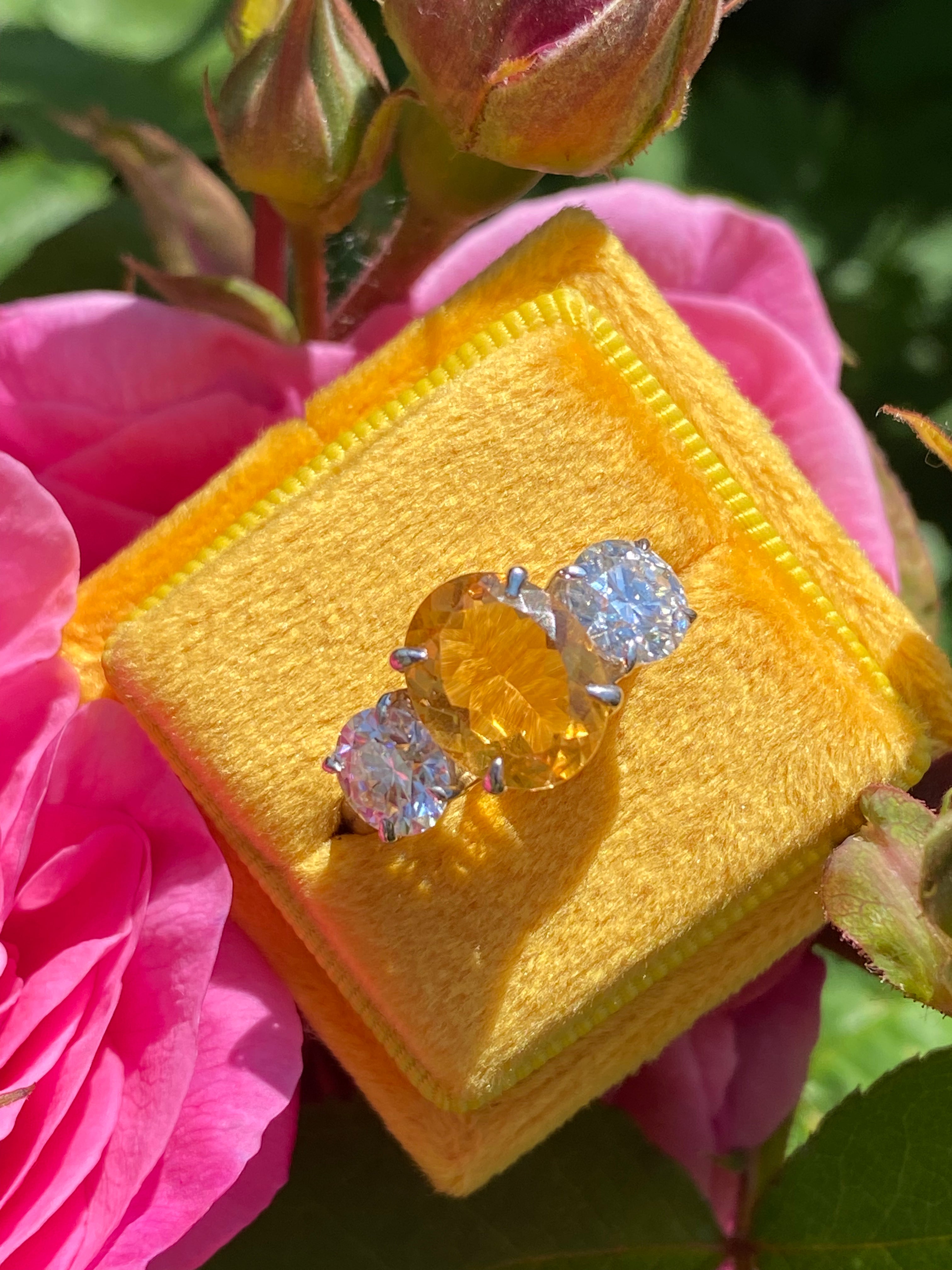 2.66 Carat Oval Cut Citrine and 1.85 Carat Moissanite Three Stone Ring in Sterling Silver