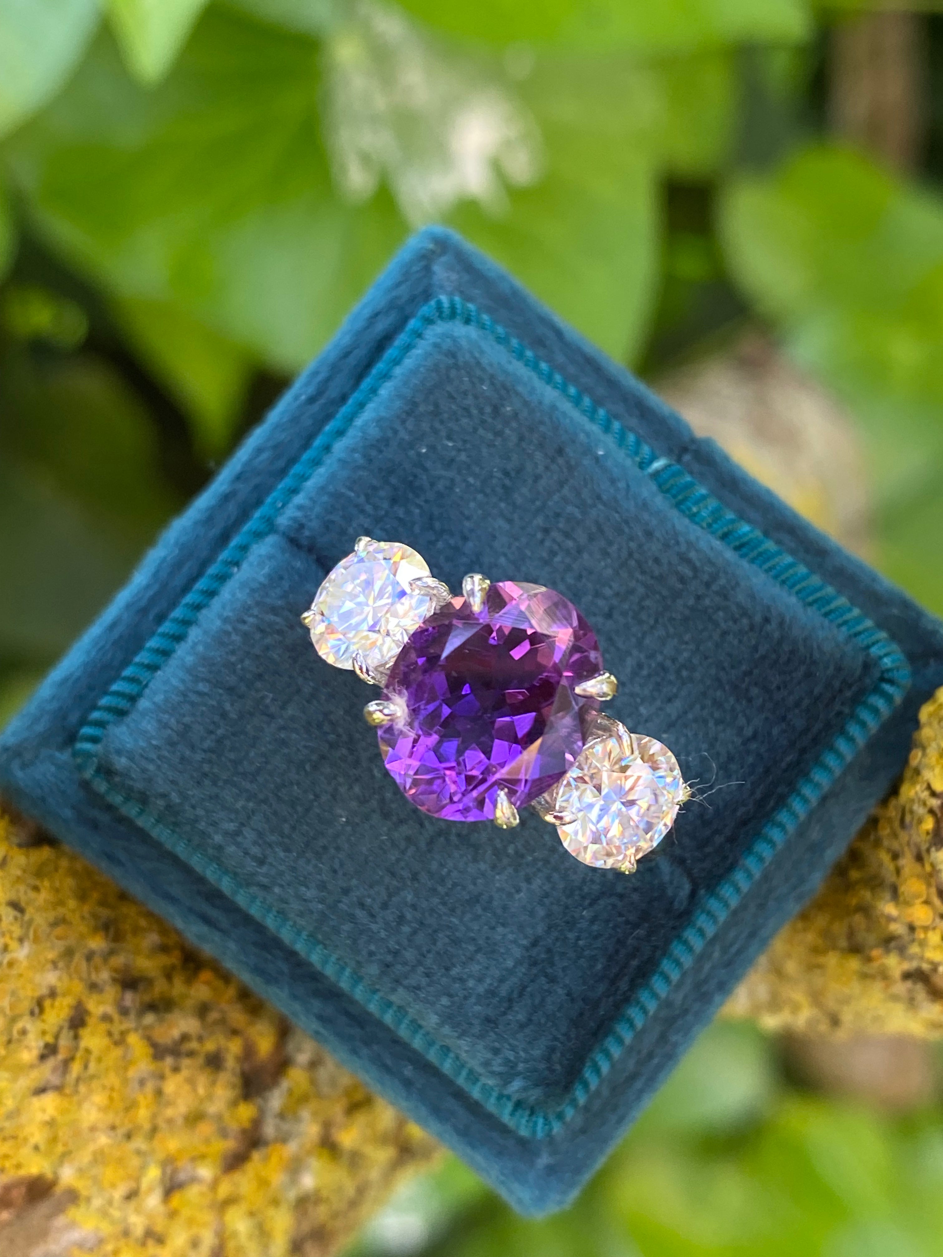 3.42 Carat Oval Cut Amethyst and 1.85 Carat Moissanite Three Stone Ring in Sterling Silver