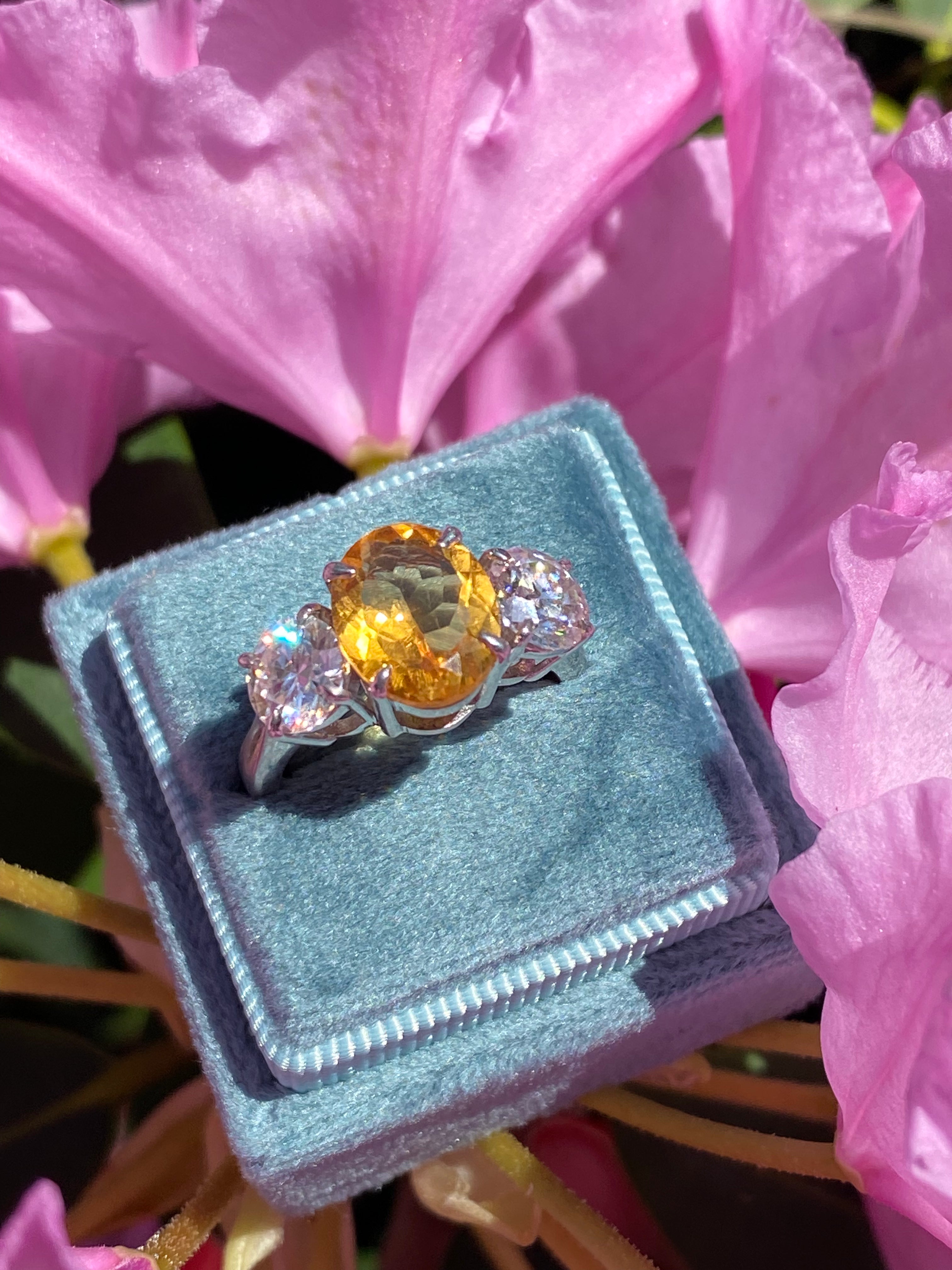 2.66 Carat Oval Cut Citrine and 1.85 Carat Moissanite Three Stone Ring in Sterling Silver