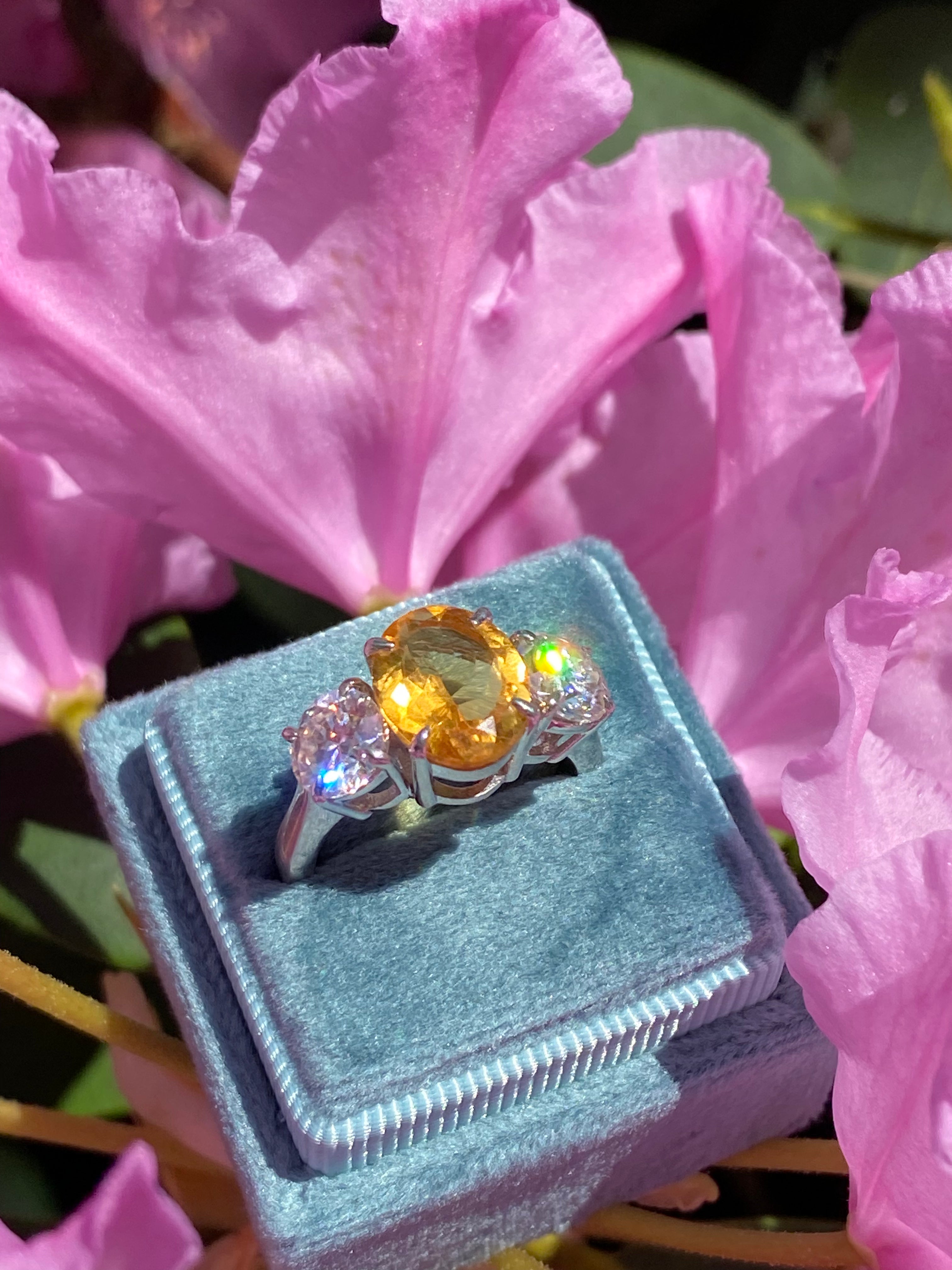 2.66 Carat Oval Cut Citrine and 1.85 Carat Moissanite Three Stone Ring in Sterling Silver