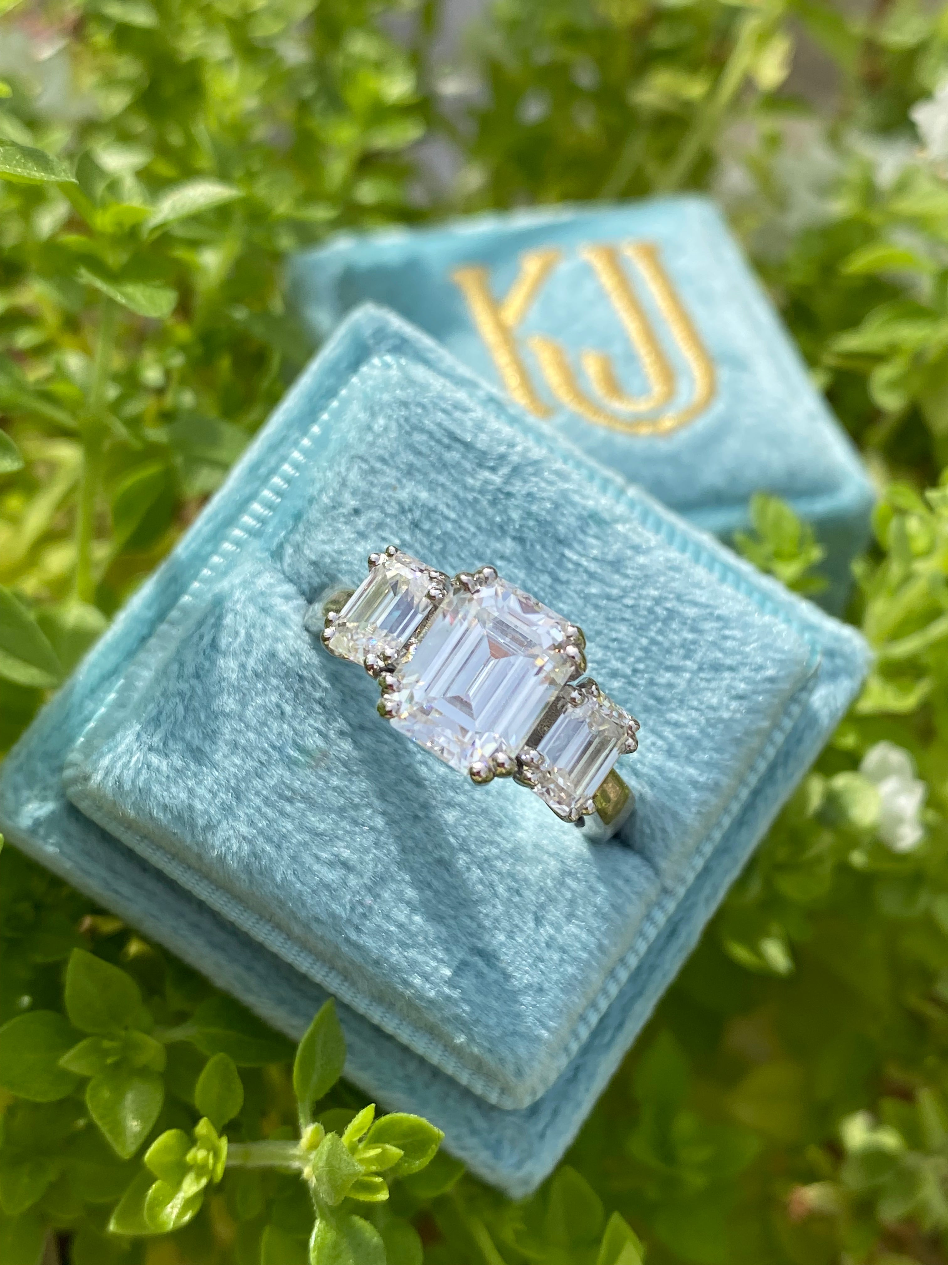 3.50 CTW Emerald Cut Moissanite Three Stone Ring in Sterling Silver