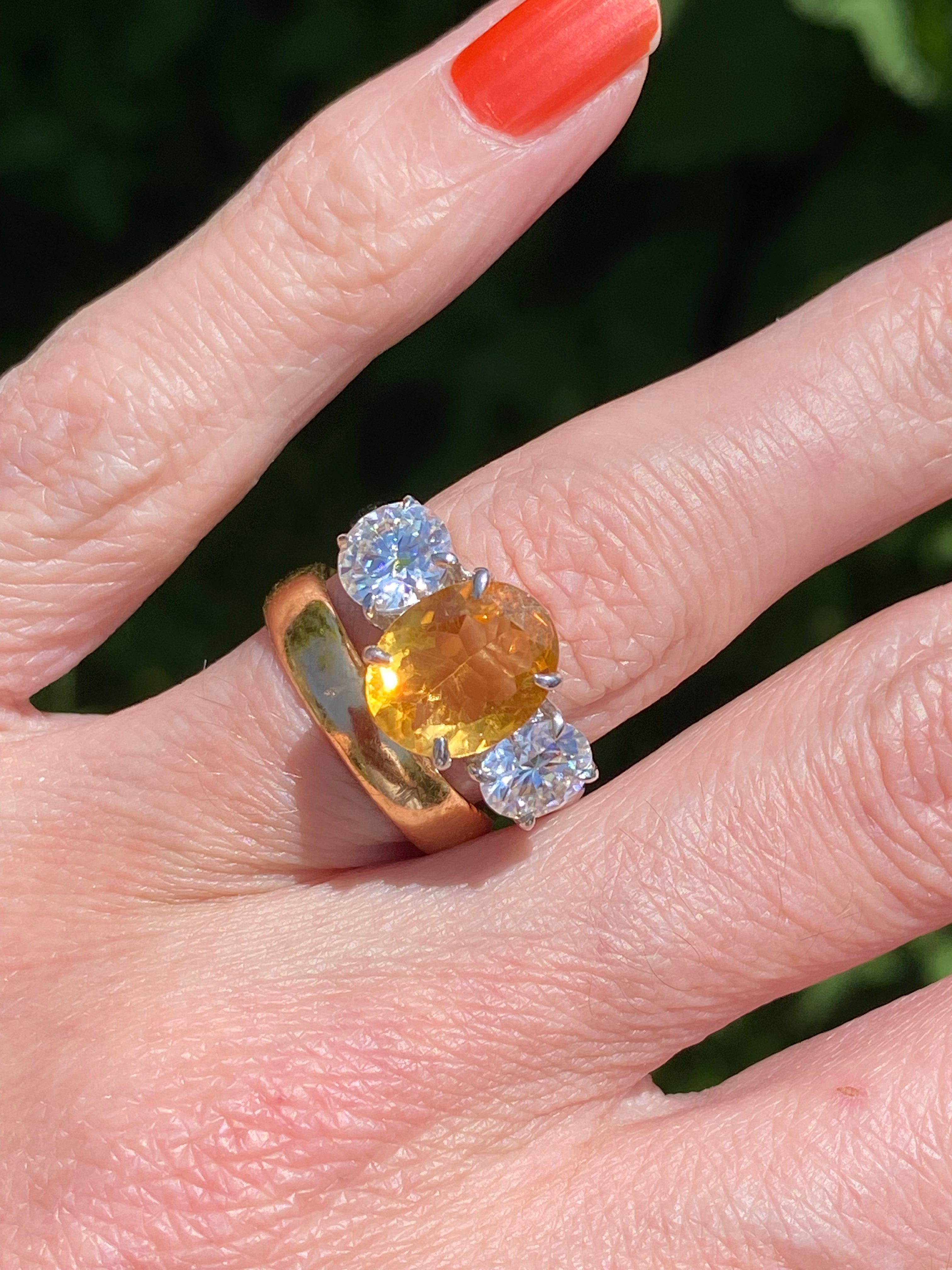 2.66 Carat Oval Cut Citrine and 1.85 Carat Moissanite Three Stone Ring in Sterling Silver