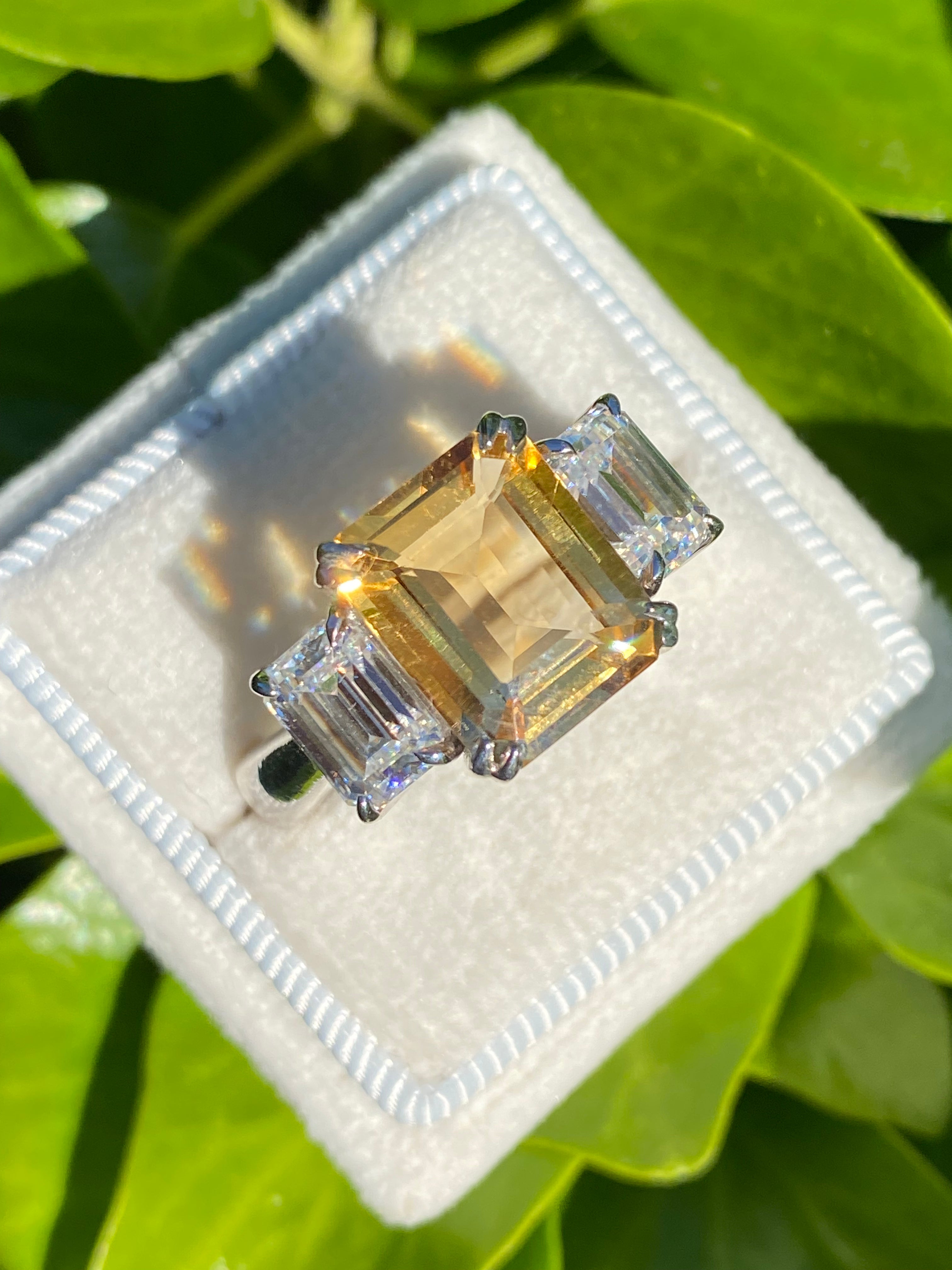 3.83 Carat Emerald Cut Citrine and 1.20 Carat Moissanite Three Stone Ring in Sterling Silver