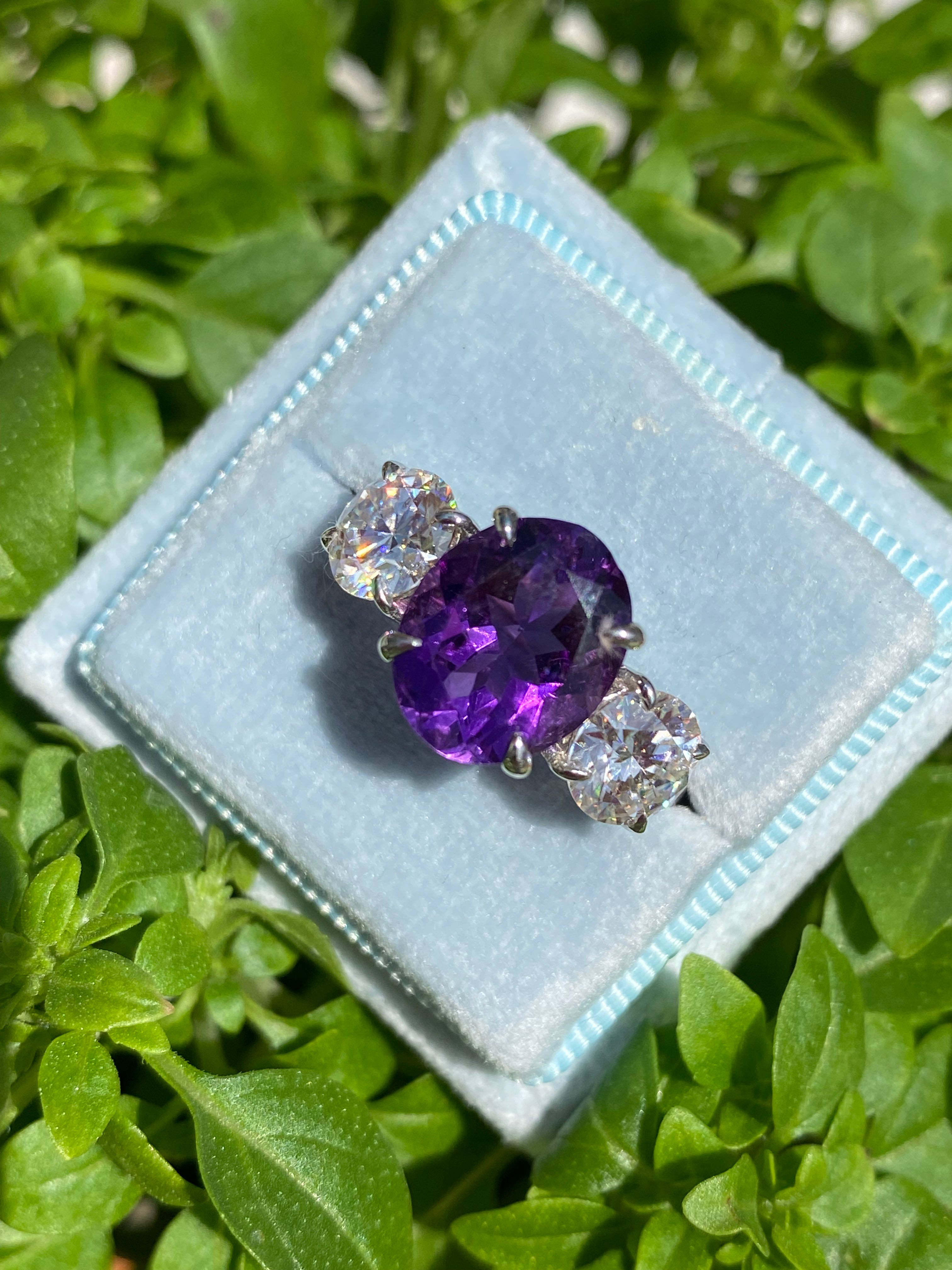 3.42 Carat Oval Cut Amethyst and 1.85 Carat Moissanite Three Stone Ring in Sterling Silver