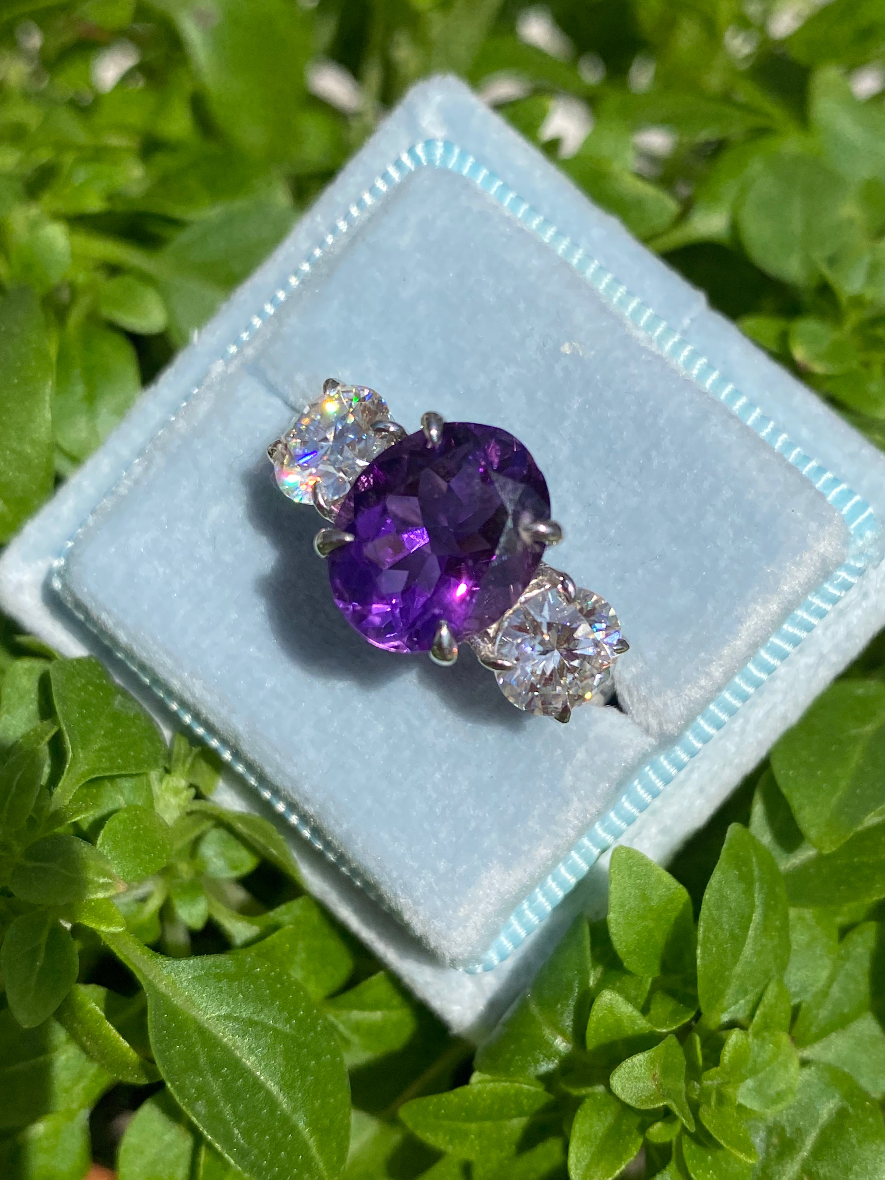 3.42 Carat Oval Cut Amethyst and 1.85 Carat Moissanite Three Stone Ring in Sterling Silver