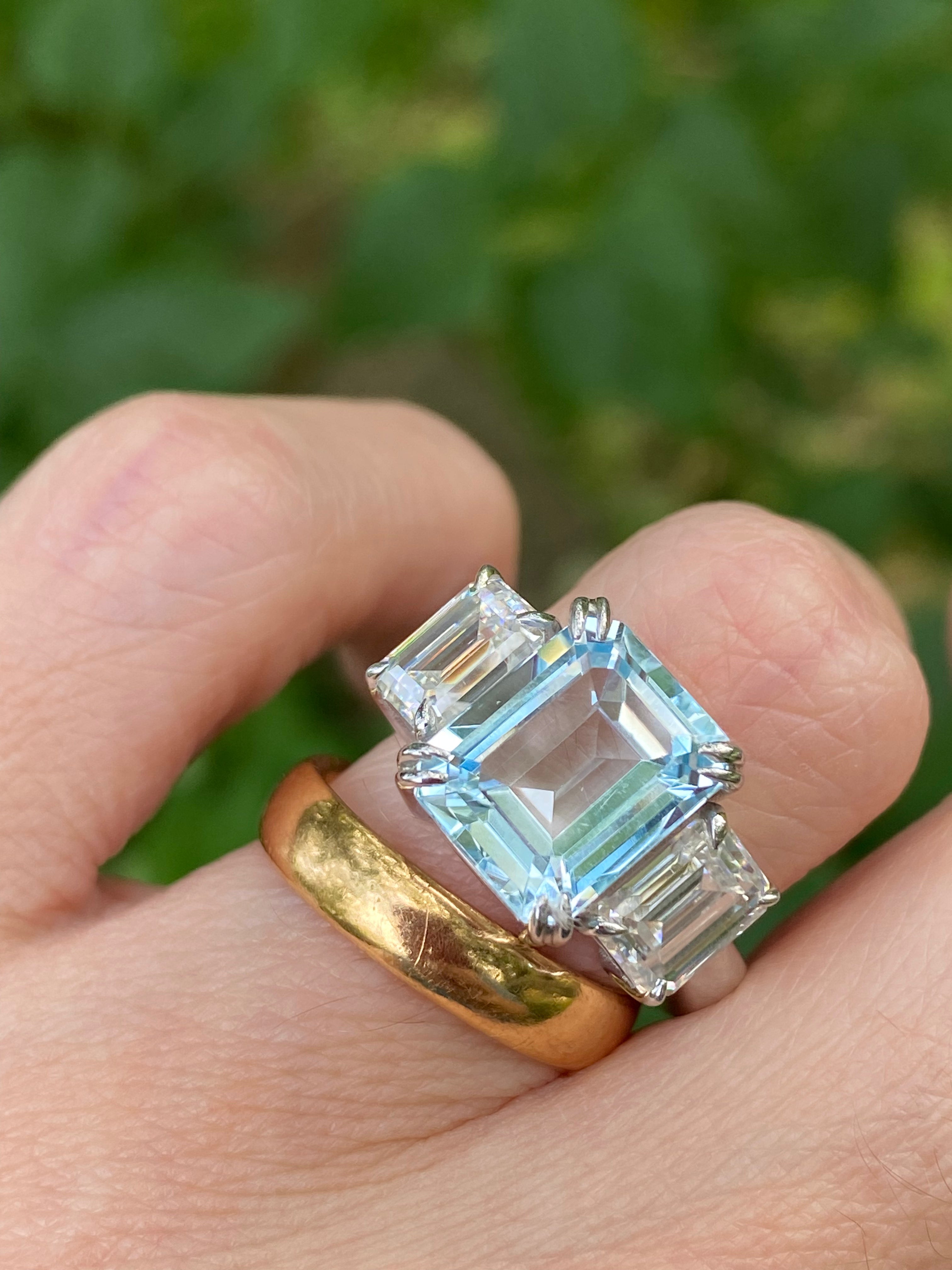 5.71 Carat Emerald Cut Blue Topaz and 2.00 Carat Moissanite Three Stone Ring in Sterling Silver
