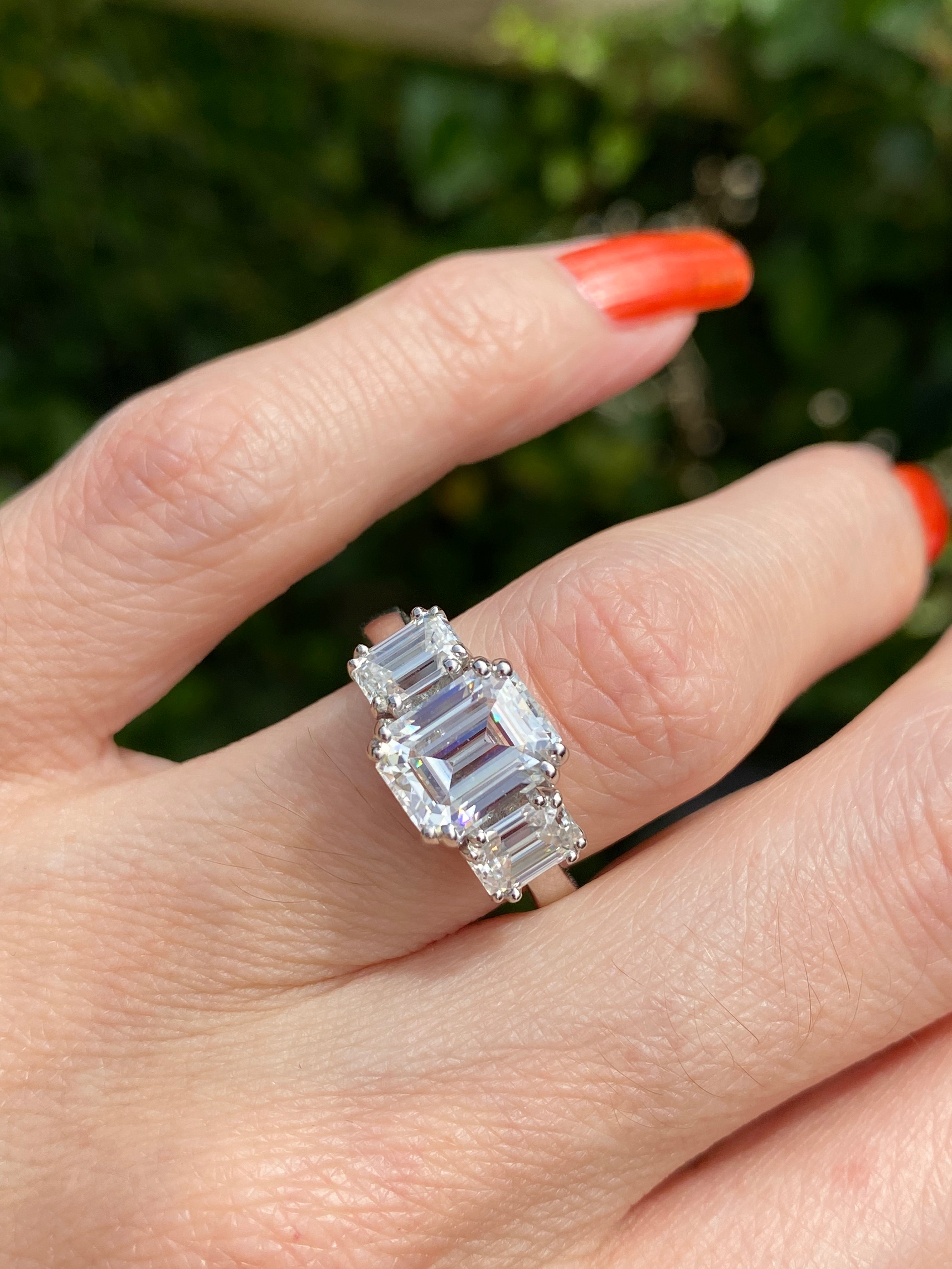 3.50 CTW Emerald Cut Moissanite Three Stone Ring in Sterling Silver