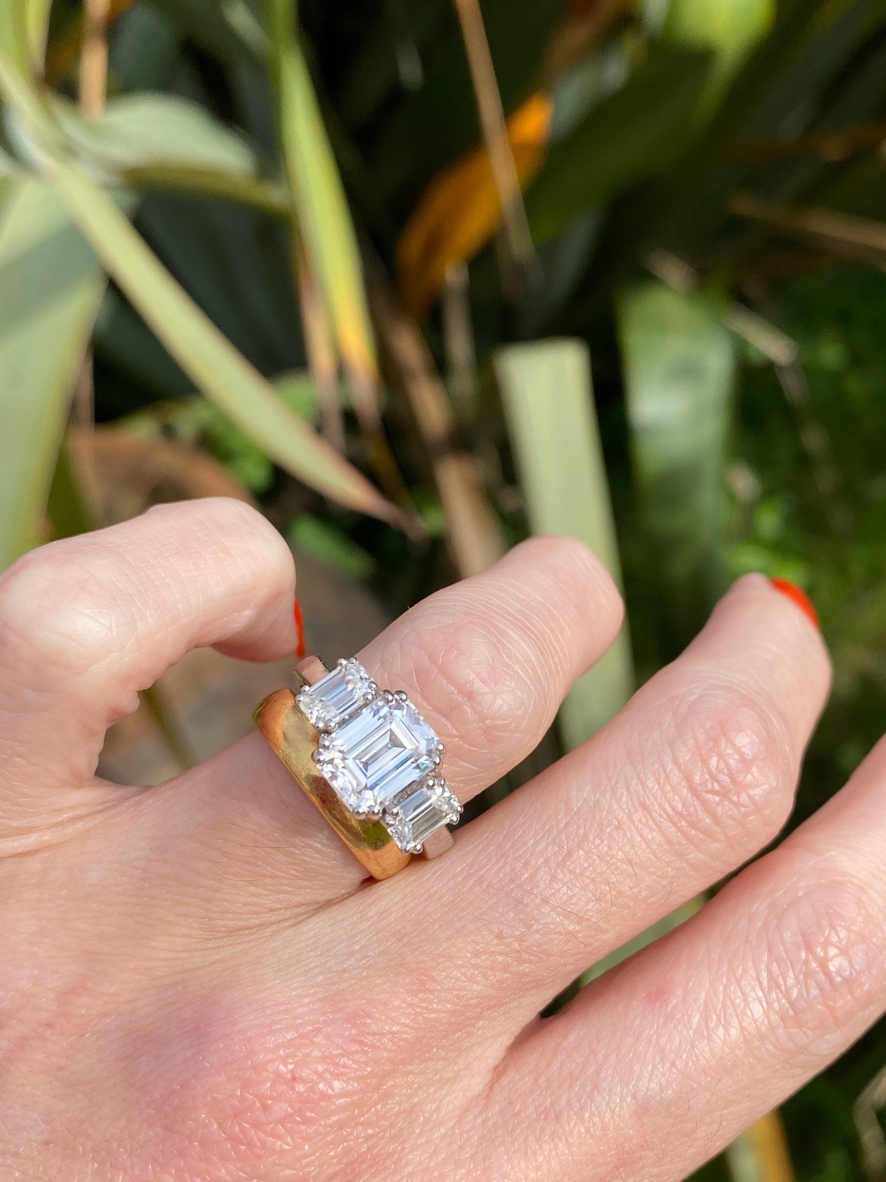 3.50 CTW Emerald Cut Moissanite Three Stone Ring in Sterling Silver