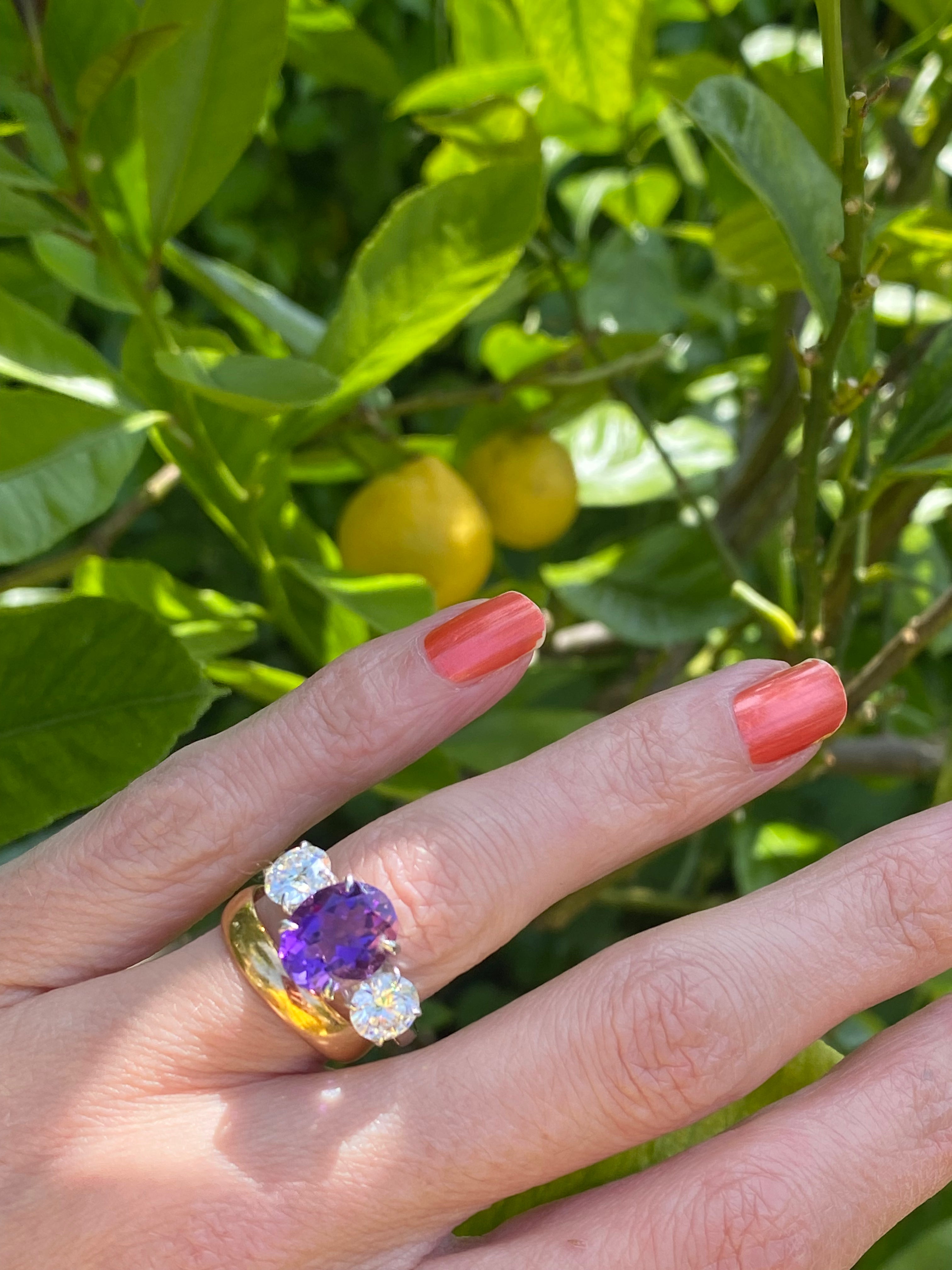 3.42 Carat Oval Cut Amethyst and 1.85 Carat Moissanite Three Stone Ring in Sterling Silver