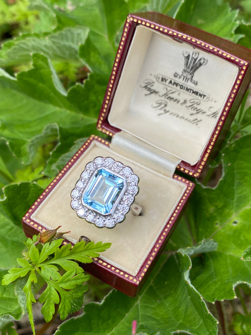 4.25 CTW Emerald Cut Blue Topaz and Moissanite Halo Cocktail Ring in Sterling Silver