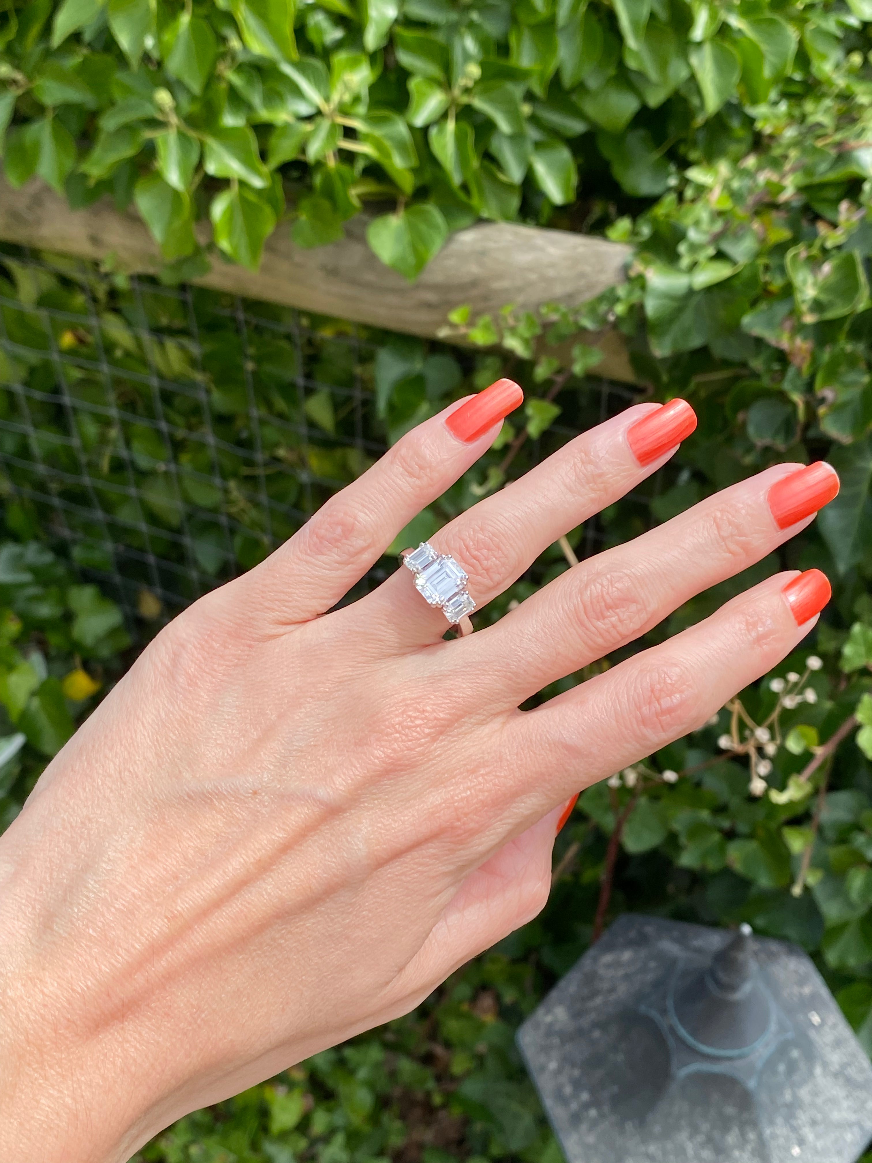 3.50 CTW Emerald Cut Moissanite Three Stone Ring in Sterling Silver