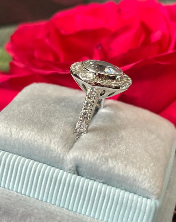 Round Cut Colourless White Sapphire and Diamond Halo Engagement Ring in White Gold 