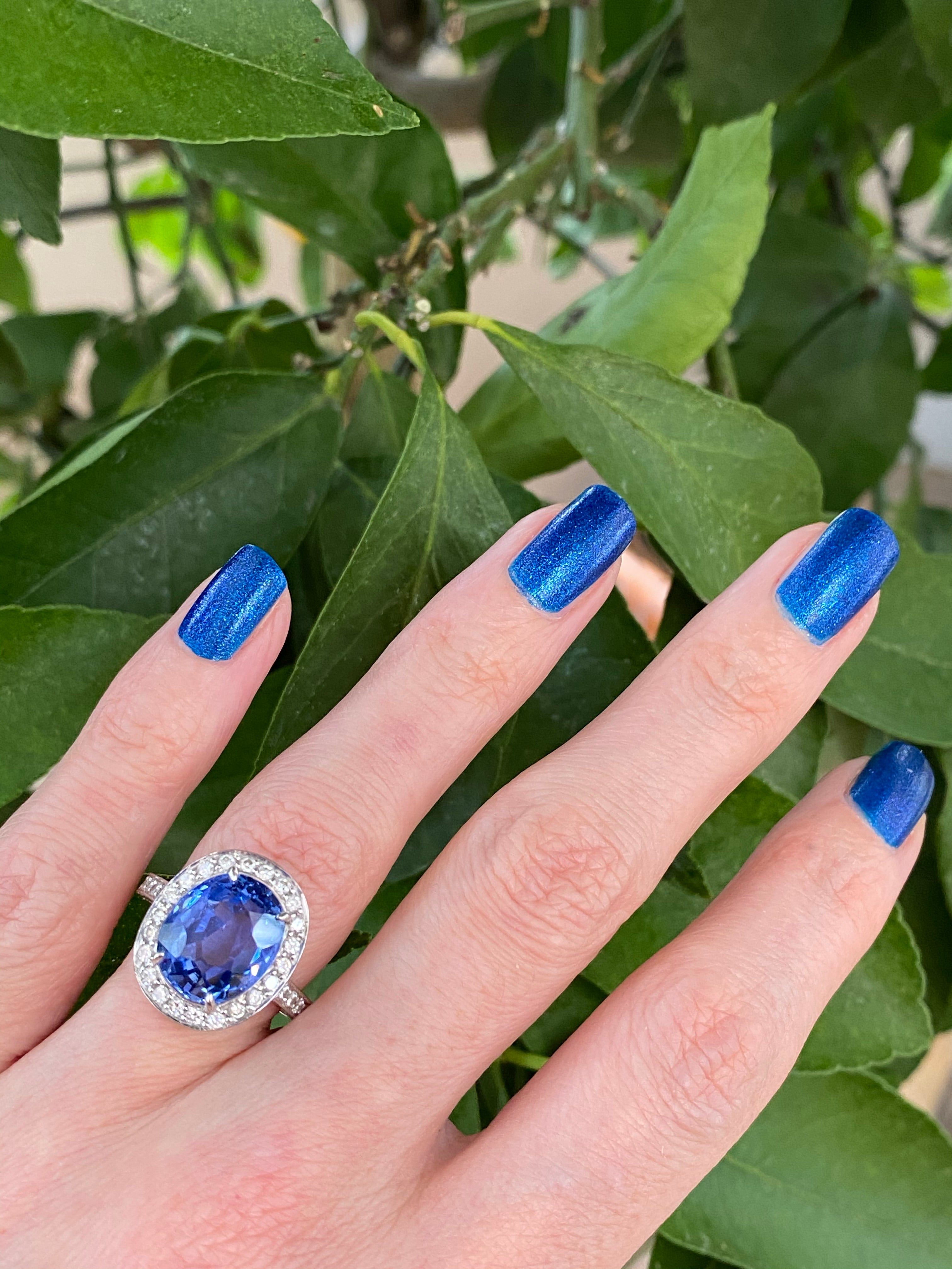 9.50 Oval-cut Carat Blue Ceylon Sapphire and DIamond Halo Ring 