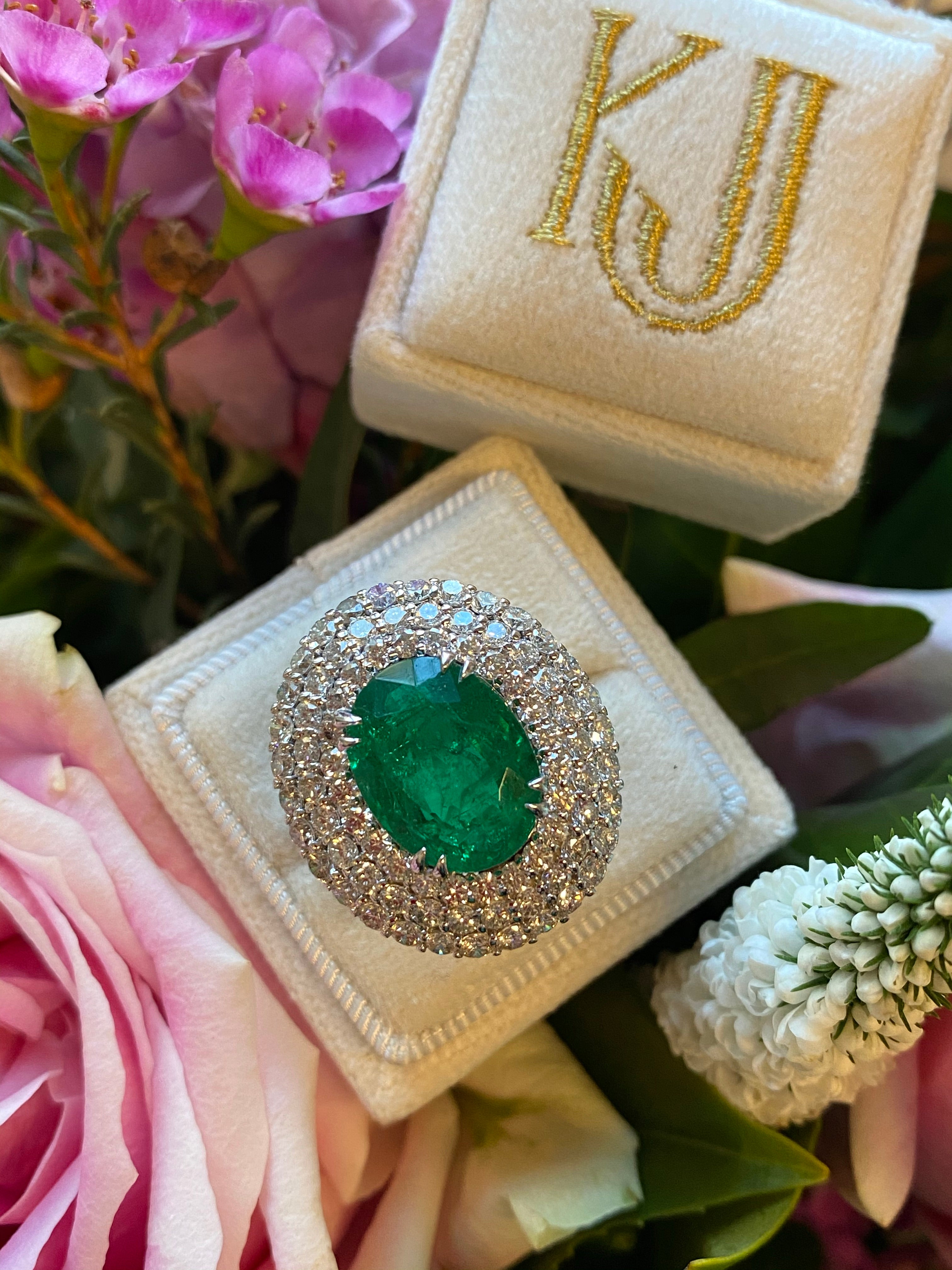 6.98 Carat Oval Cut Emerald and Diamond Triple Halo Ring in Platinum