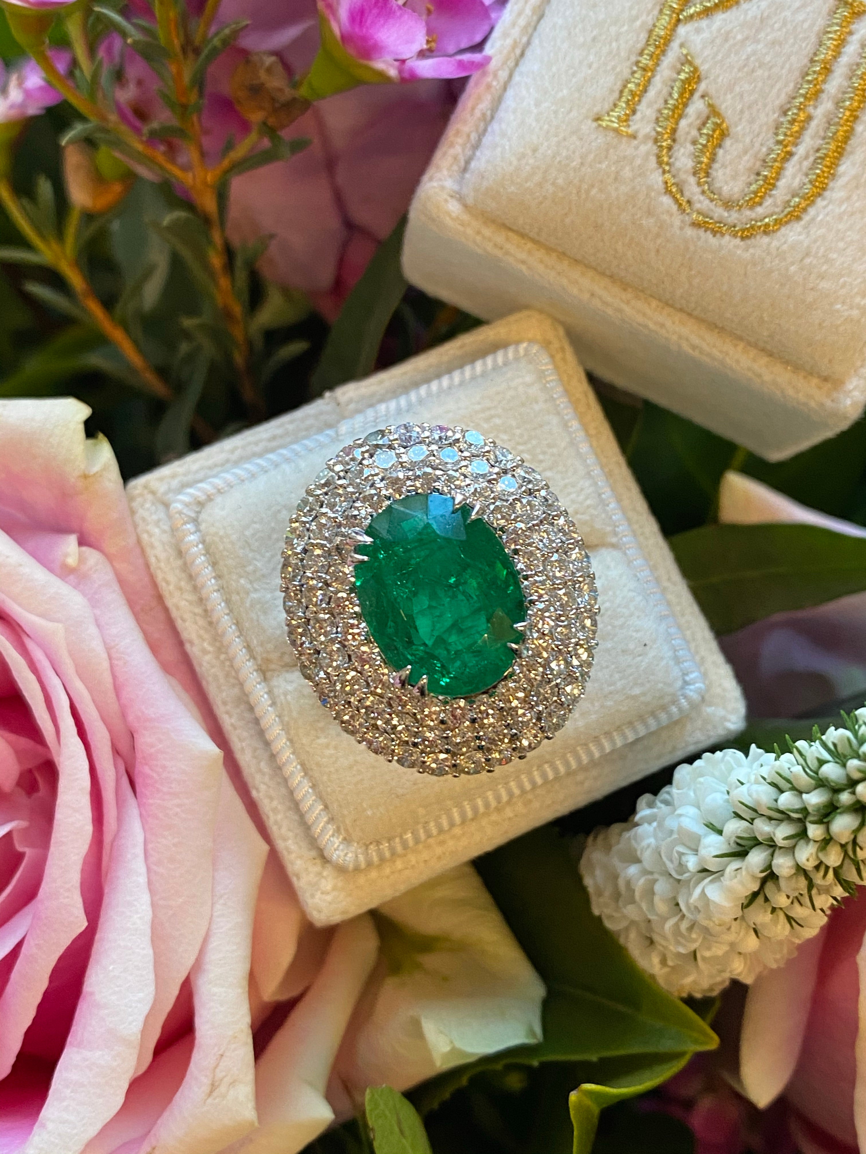 6.98 Carat Oval Cut Emerald and Diamond Triple Halo Ring in Platinum