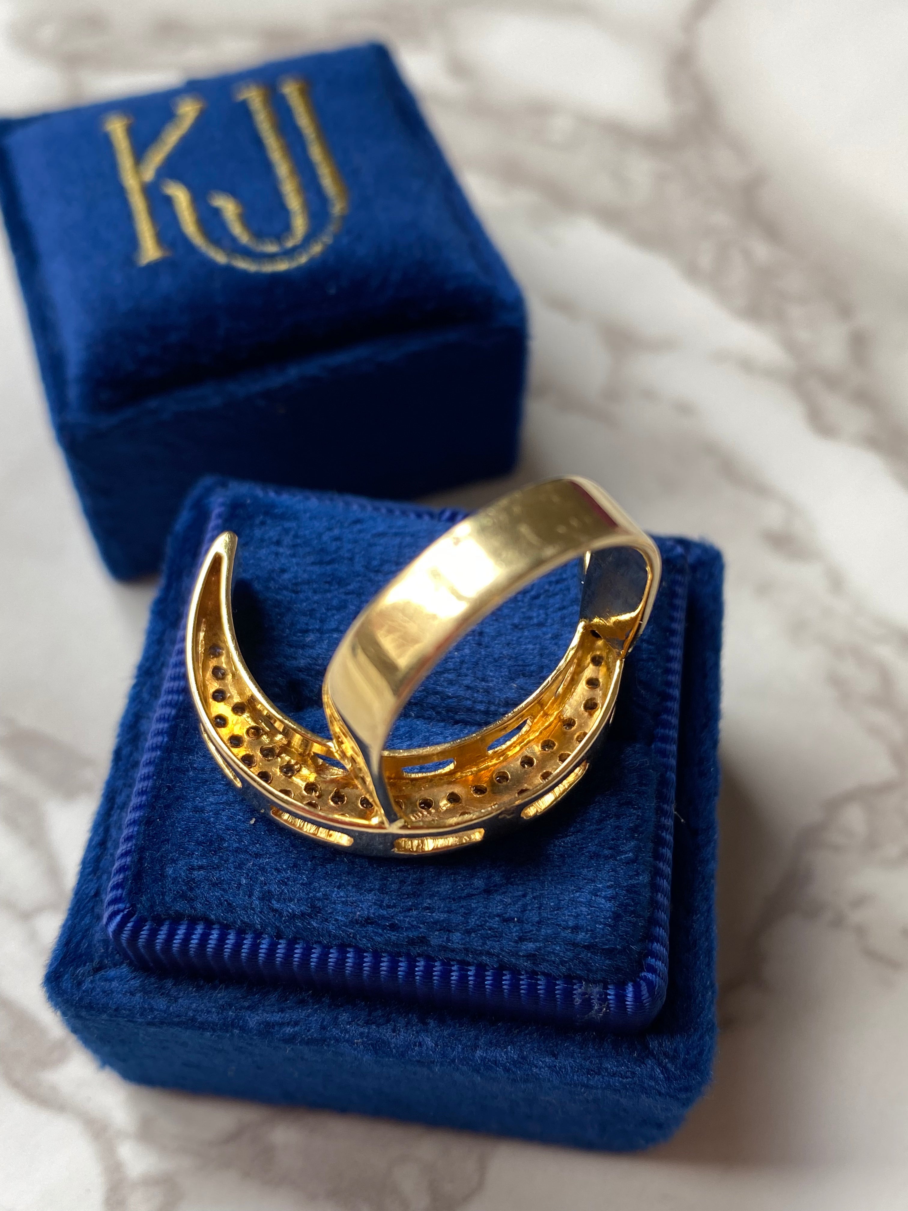 Diamond pave crescent moon cocktail ring in yellow gold 