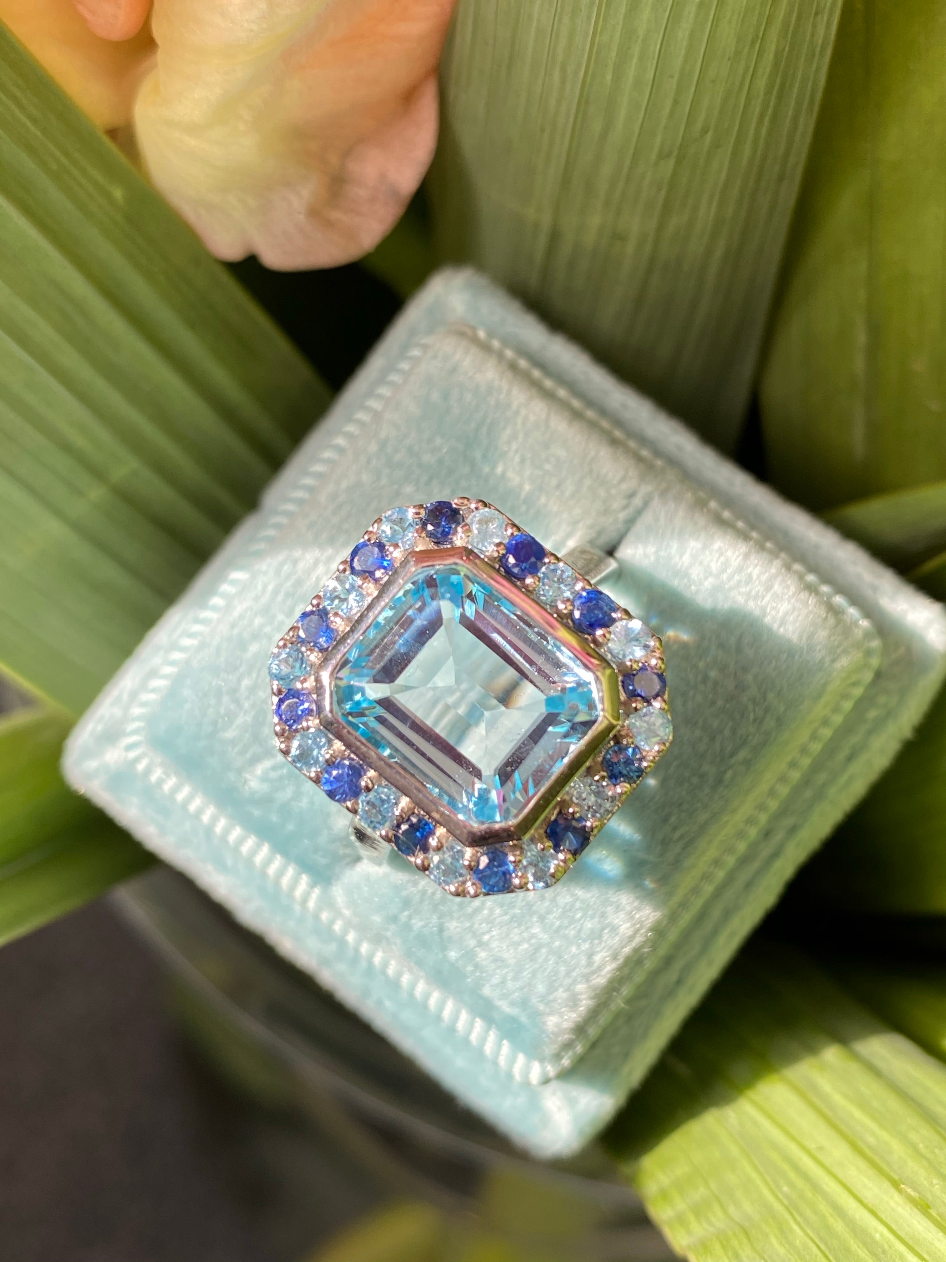 Blue Topaz and Blue Sapphire Halo Cocktail Ring in Sterling Silver