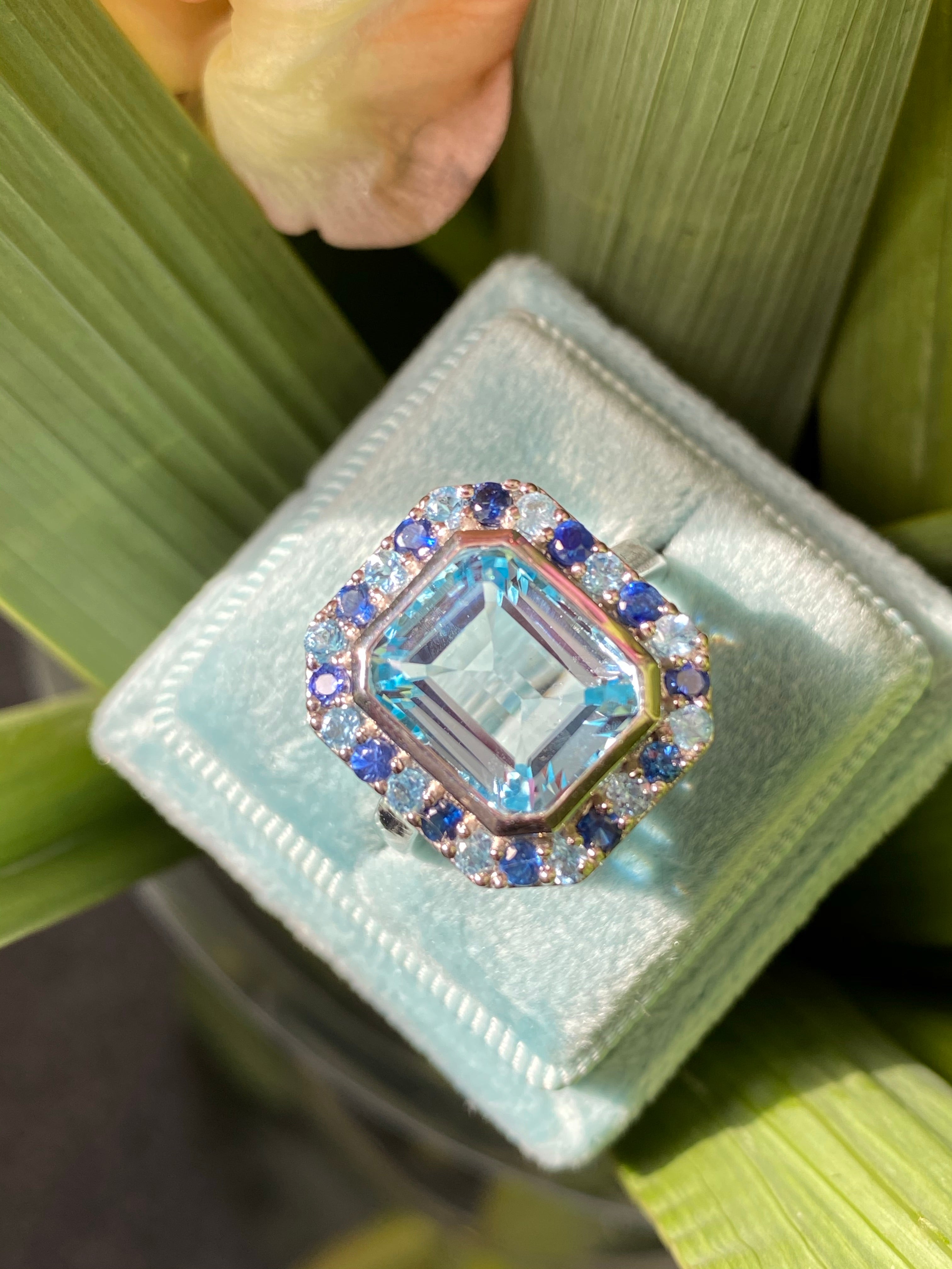 Blue Topaz and Blue Sapphire Halo Cocktail Ring in Sterling Silver