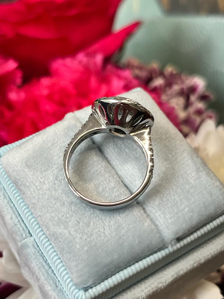 Round Cut Colourless White Sapphire and Diamond Halo Engagement Ring in White Gold 