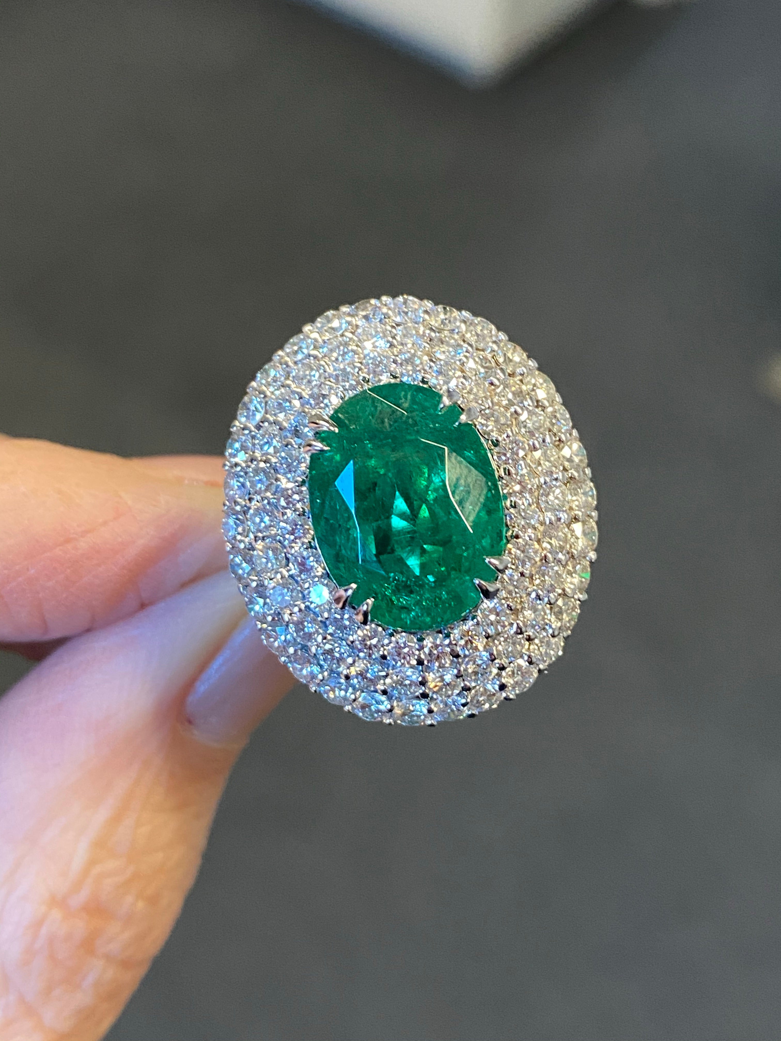 7 Carat Oval Cut Emerald and Triple Diamond Halo Engagement Cocktail Ring in Platinum 