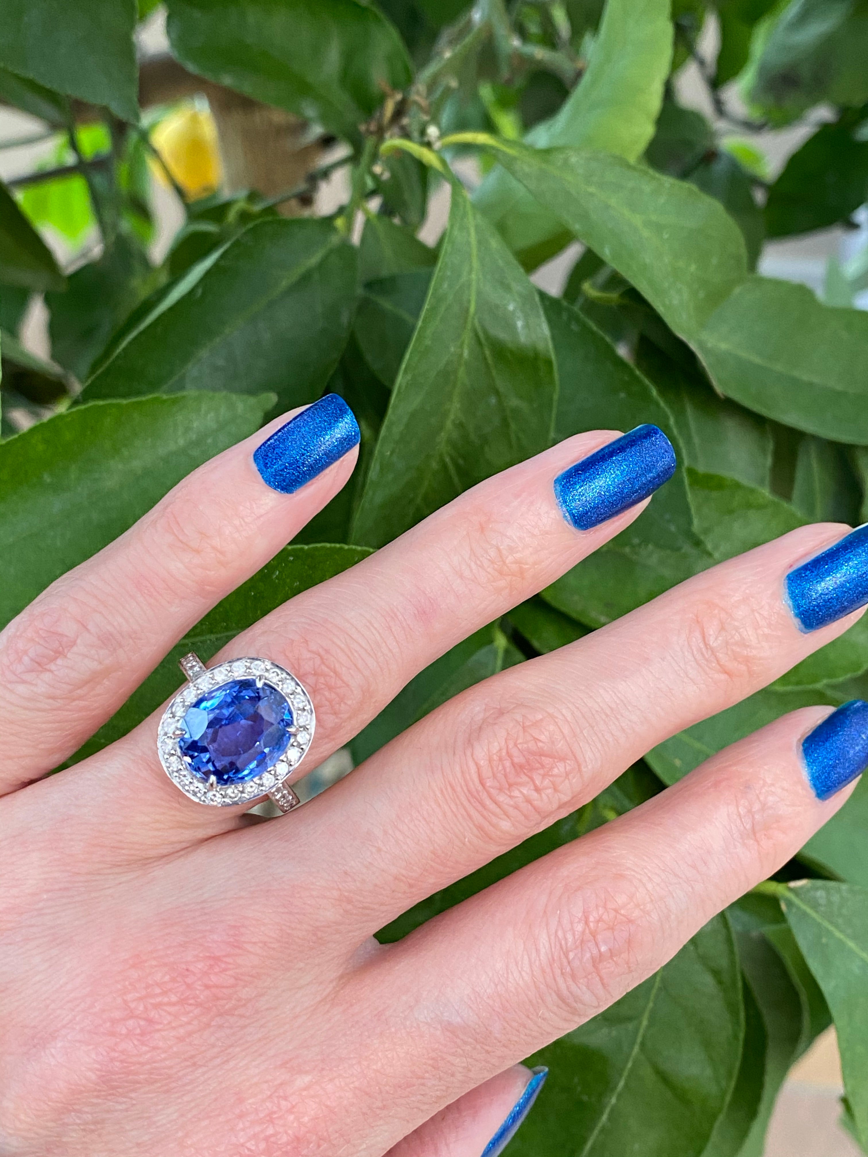 9.50 Oval-cut Carat Blue Ceylon Sapphire and DIamond Halo Ring 