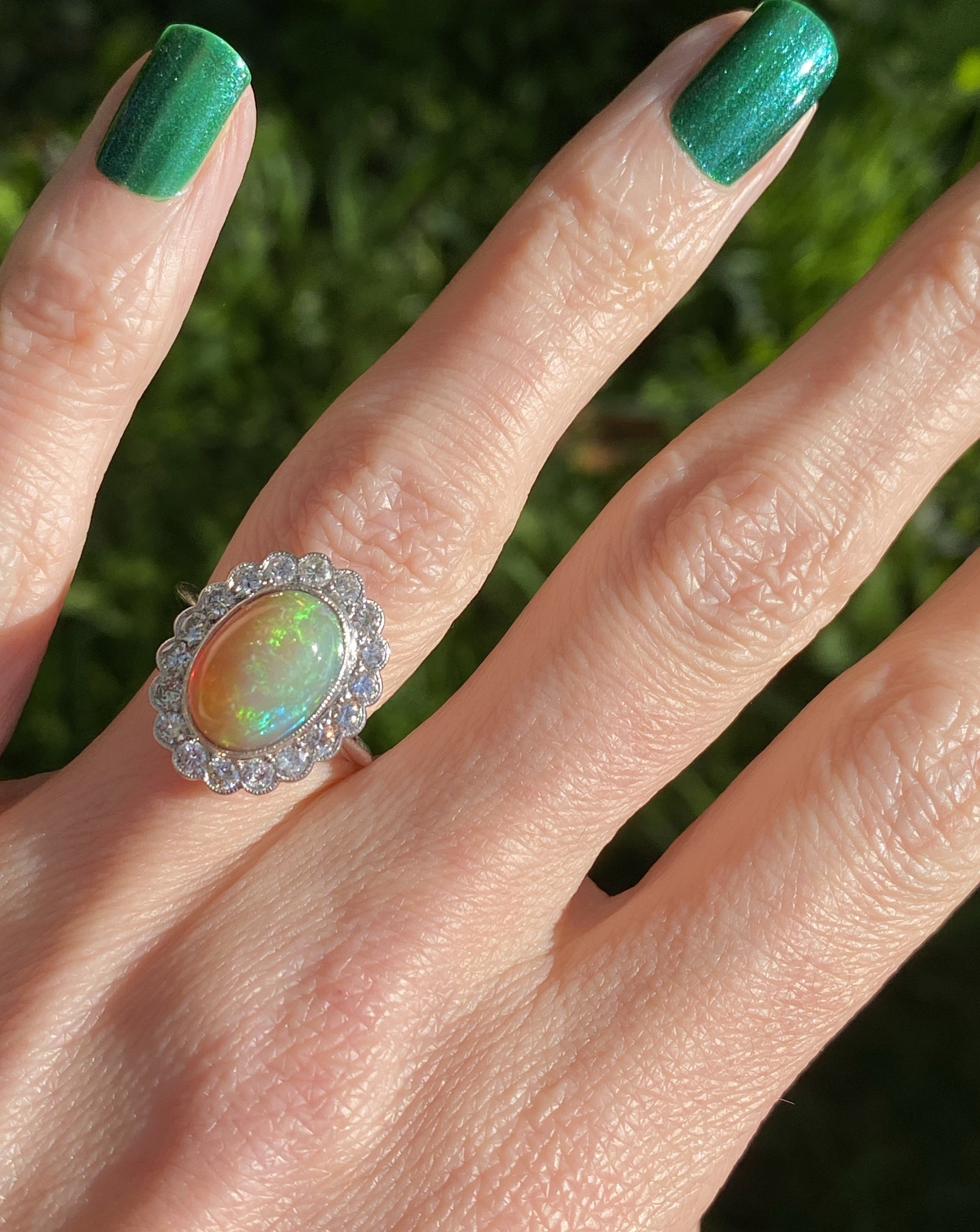 Oval Opal and Diamond Halo Engagement Ring 