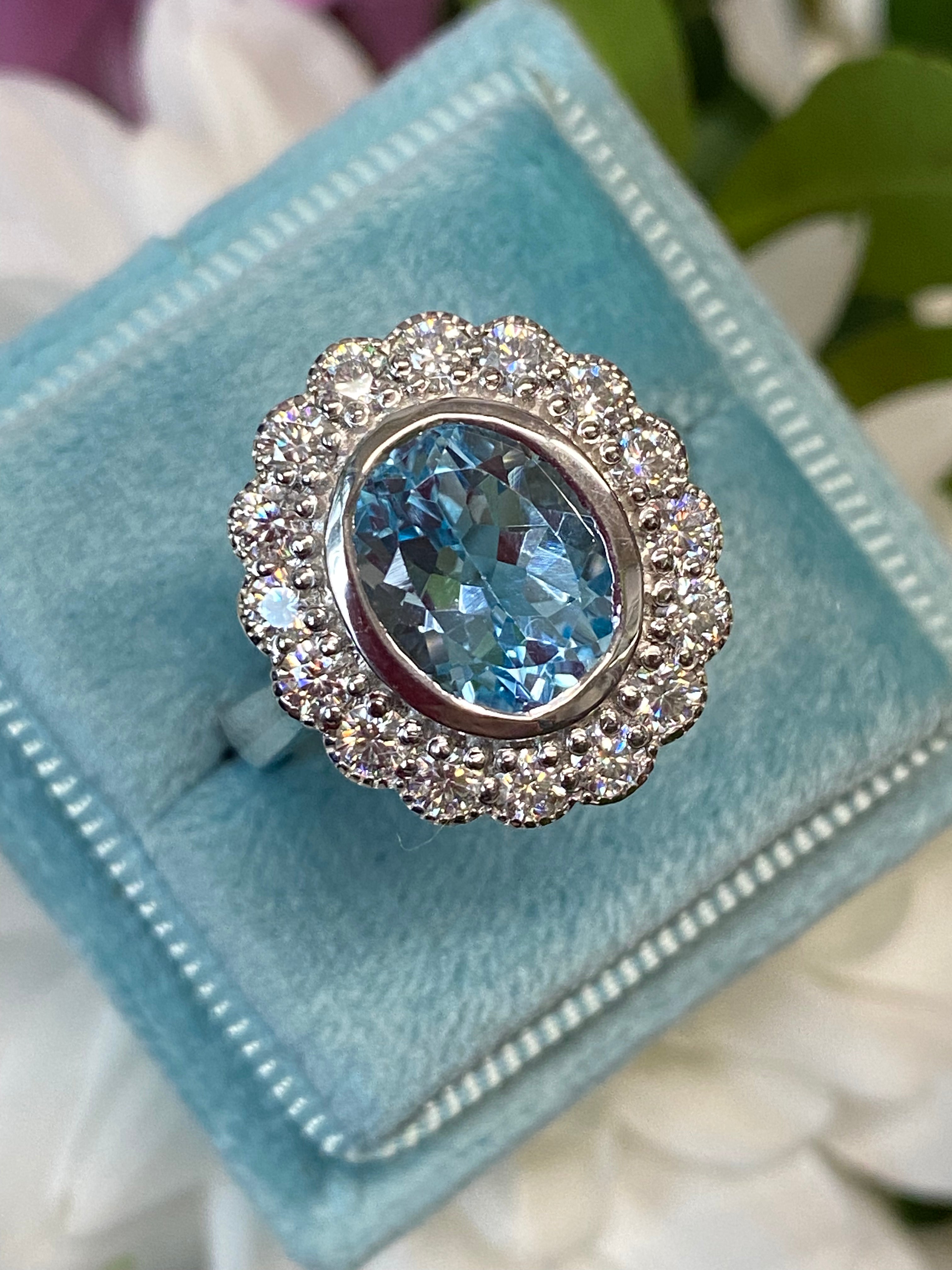 Blue Topaz and Moissanite Halo Cocktail Engagement Ring in Sterling Silver 