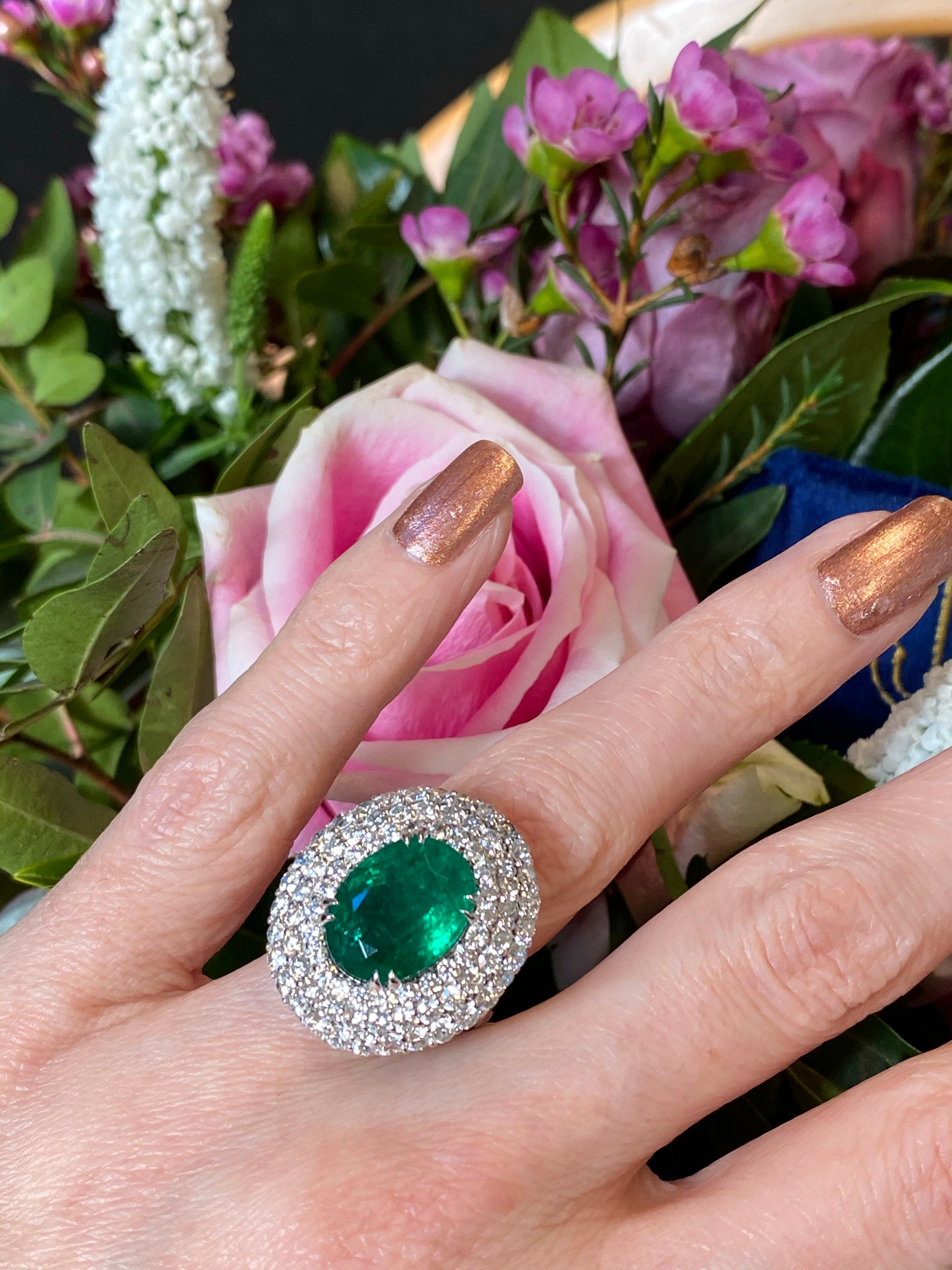 6.98 Carat Oval Cut Emerald and Diamond Triple Halo Ring in Platinum