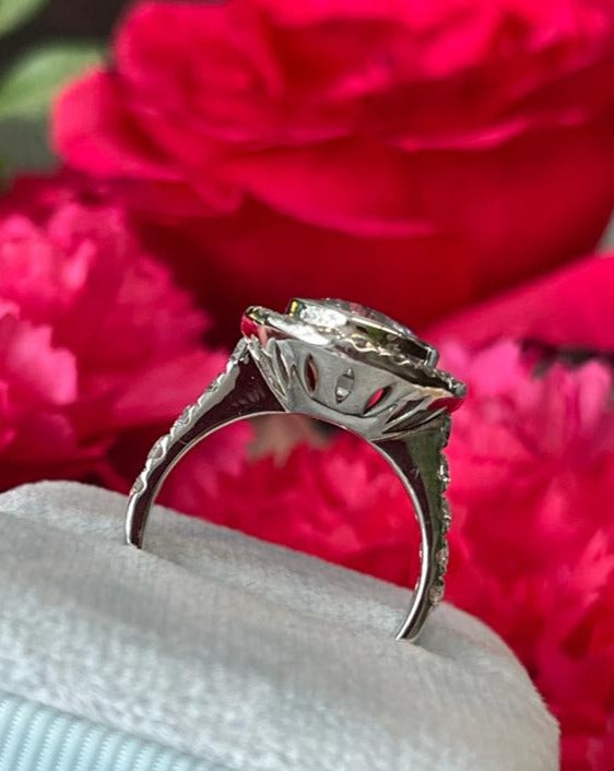 Round Cut Colourless White Sapphire and Diamond Halo Engagement Ring in White Gold 