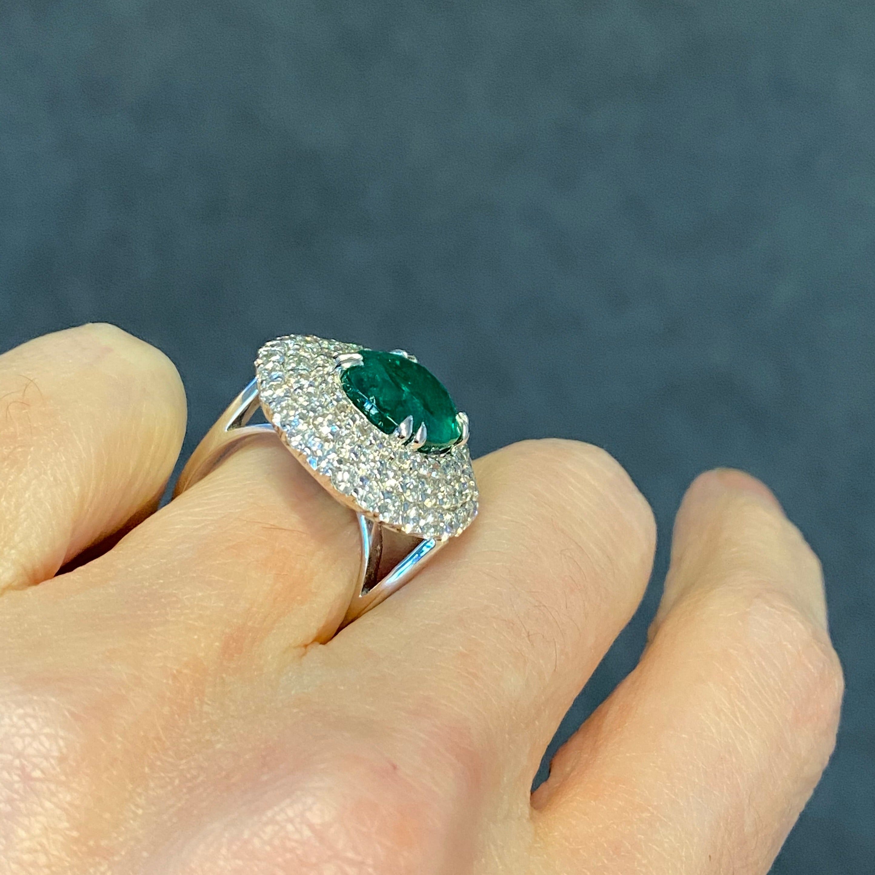 7 Carat Oval Cut Emerald and Triple Diamond Halo Engagement Cocktail Ring in Platinum 
