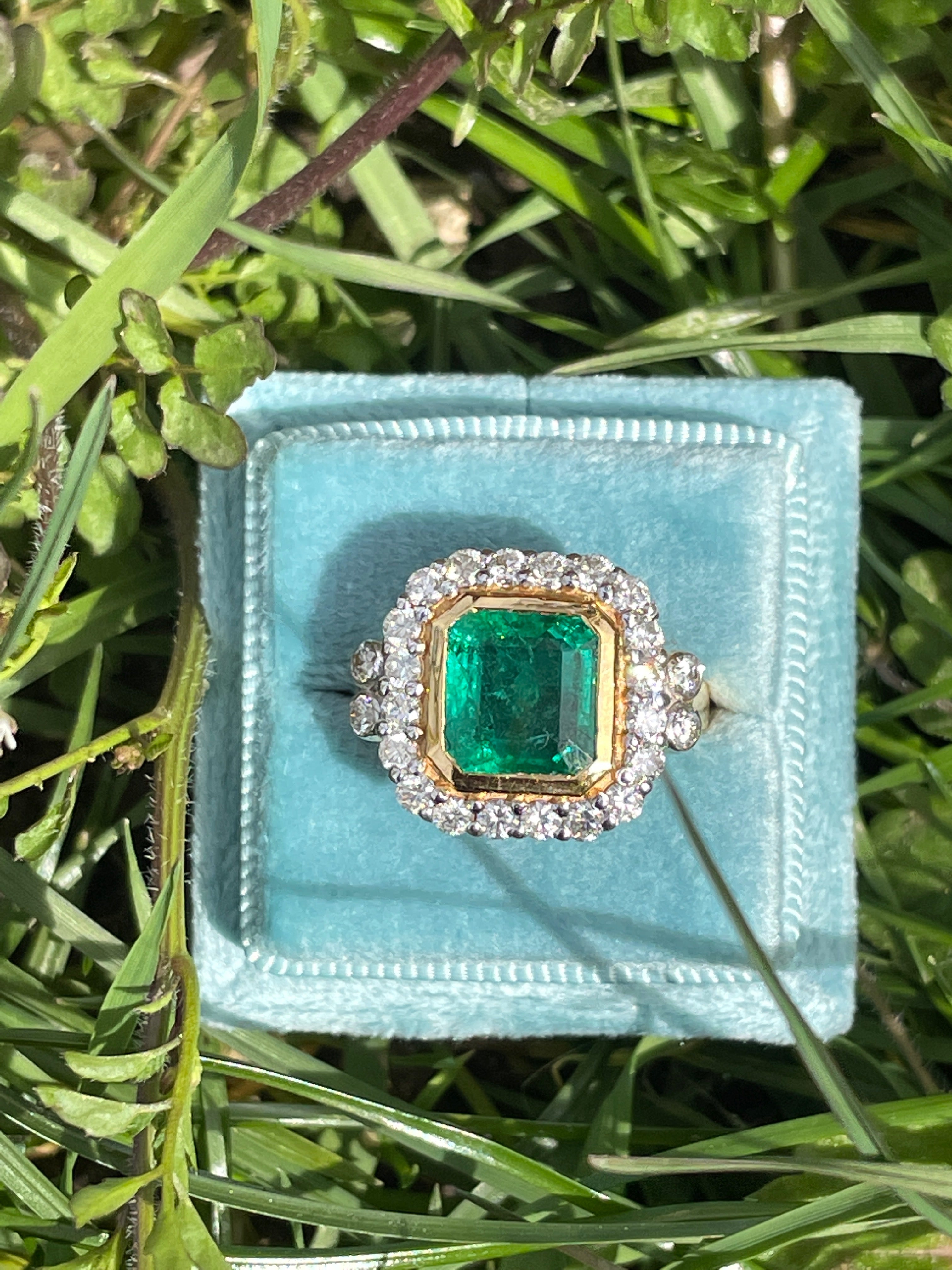 3 Carat Emerald and Diamond Halo Bezel Set Cocktail Engagement Ring in White and Yellow Gold 