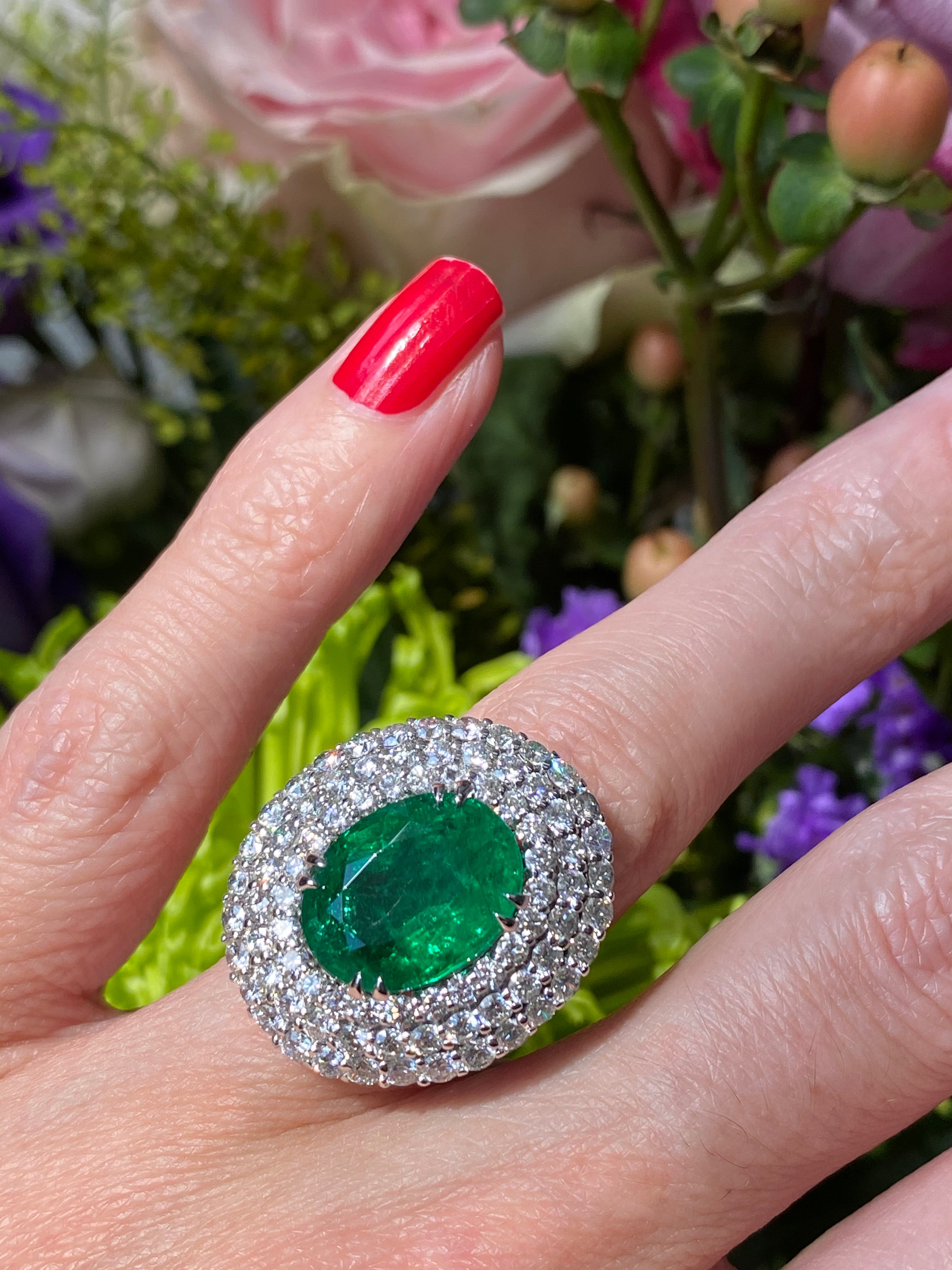 6.98 Carat Oval Cut Emerald and Diamond Triple Halo Ring in Platinum
