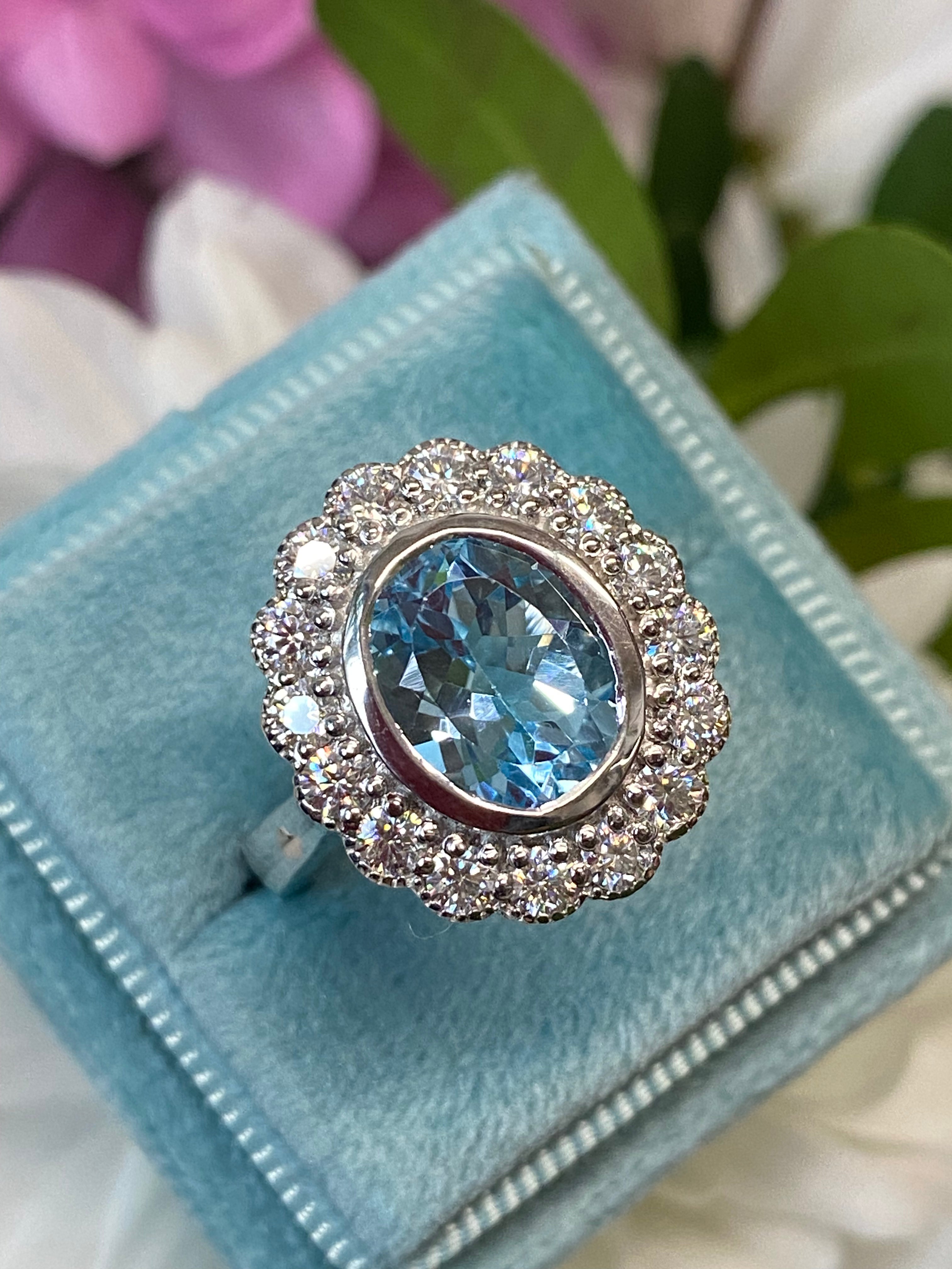 Blue Topaz and Moissanite Halo Cocktail Engagement Ring in Sterling Silver 