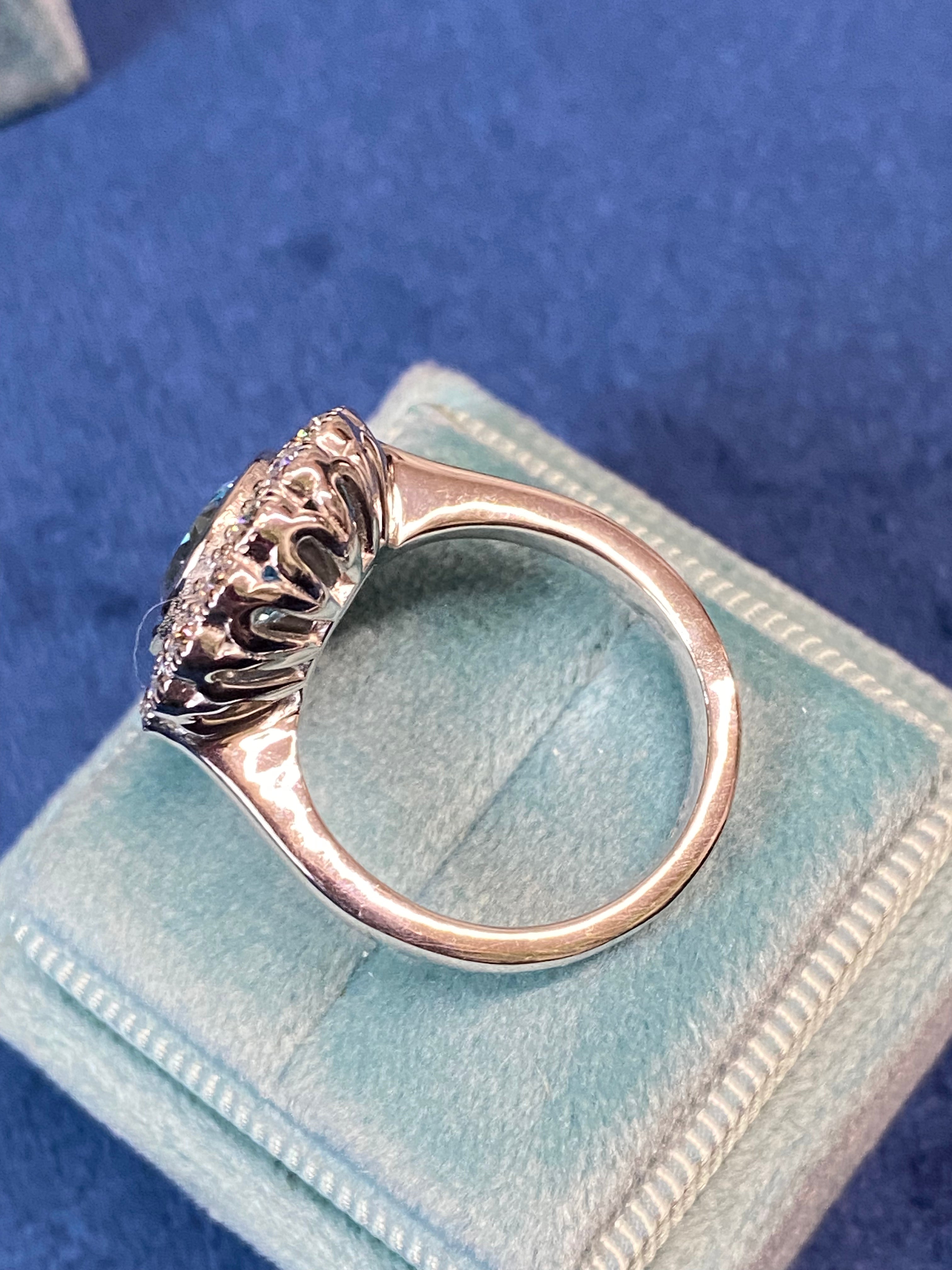 4.25 CTW Oval Cut Blue Topaz and Moissanite Halo Cocktail Ring