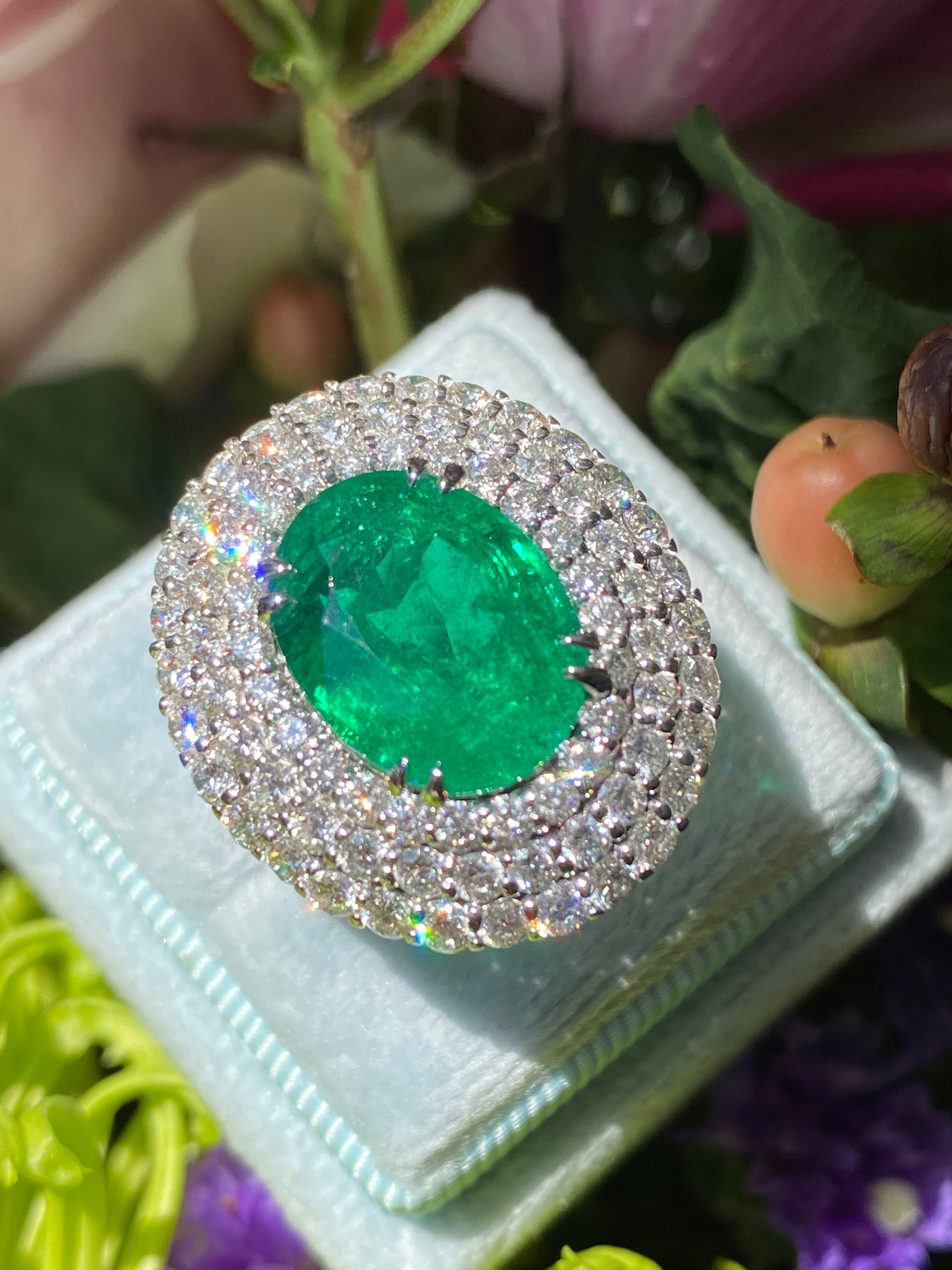 6.98 Carat Oval Cut Emerald and Diamond Triple Halo Ring in Platinum