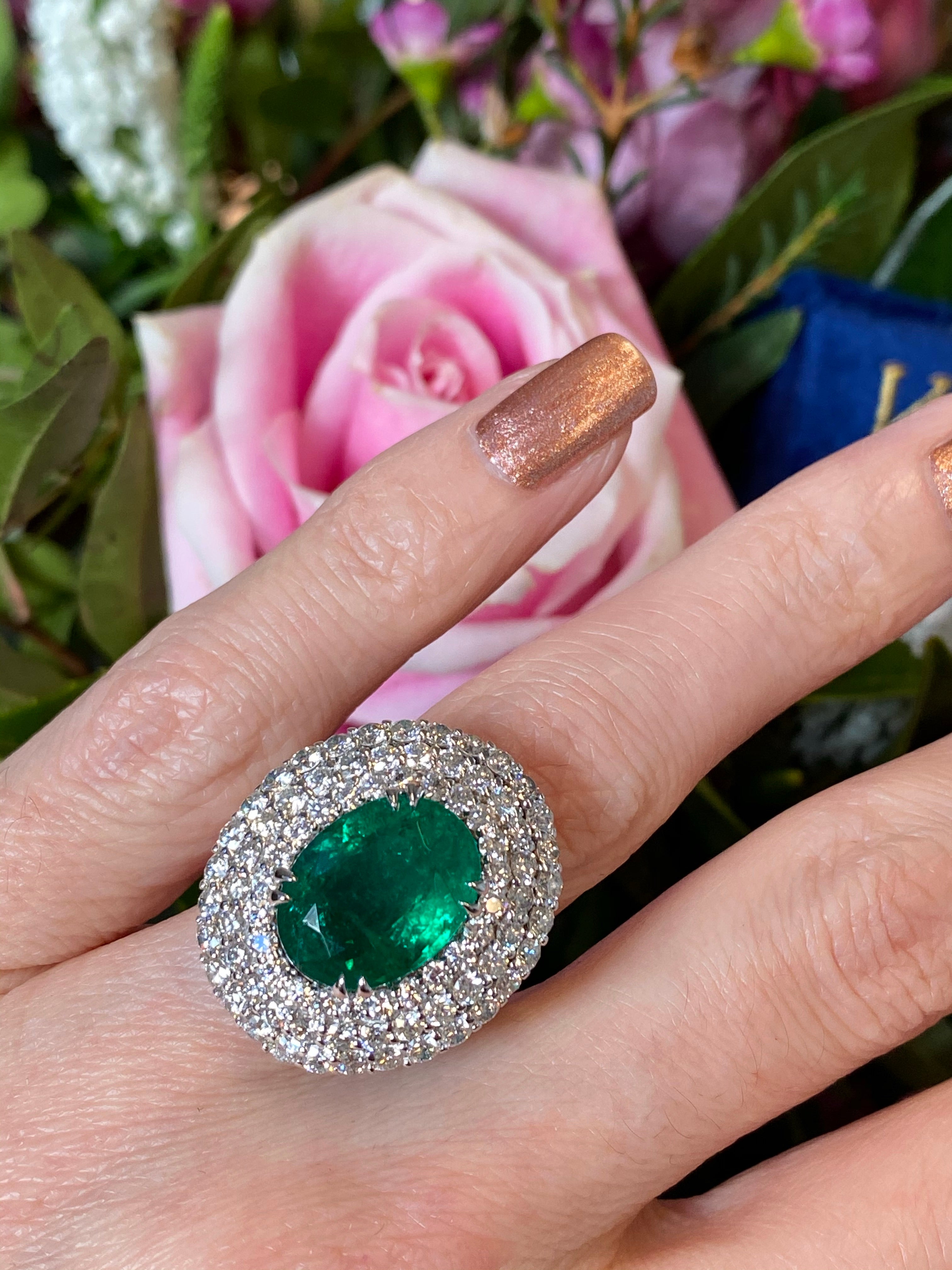 6.98 Carat Oval Cut Emerald and Diamond Triple Halo Ring in Platinum