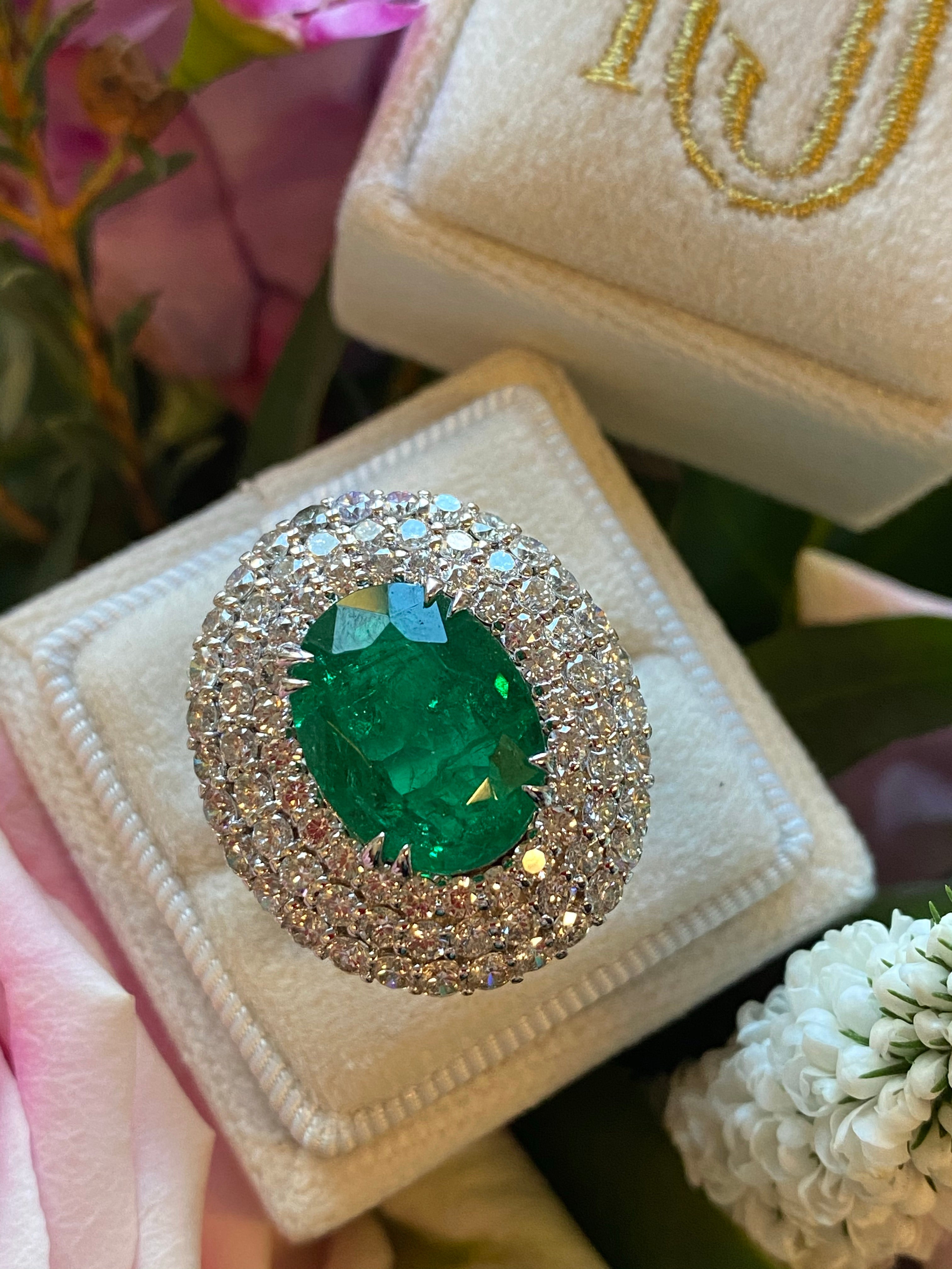6.98 Carat Oval Cut Emerald and Diamond Triple Halo Ring in Platinum