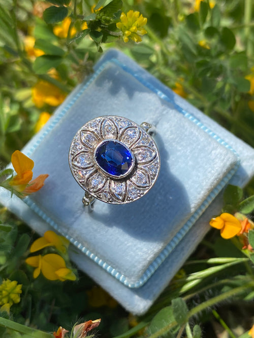 Antique Art Deco Oval Blue Sapphire and Diamond Halo Engagement Ring in Platinum 