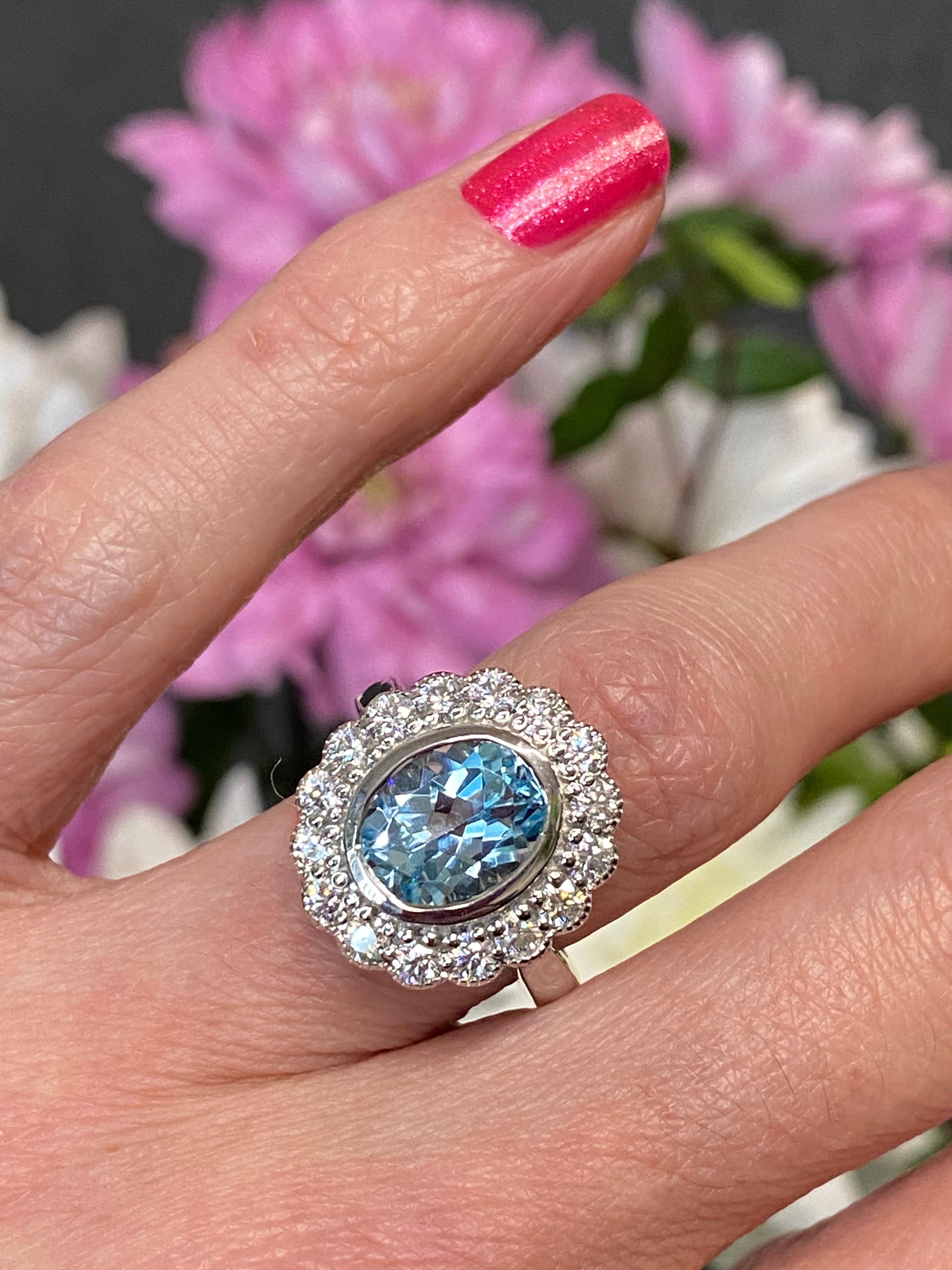 4.25 CTW Oval Cut Blue Topaz and Moissanite Halo Cocktail Ring