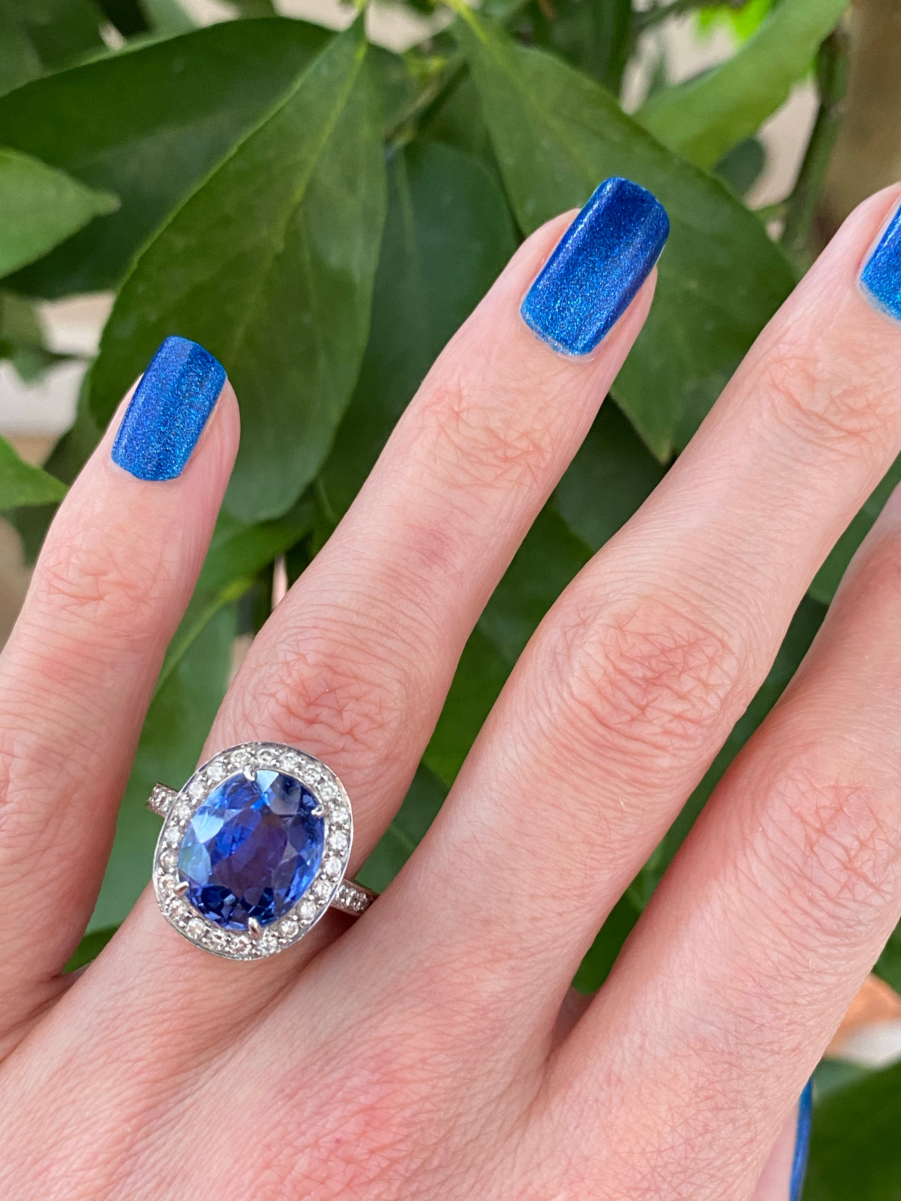 9.50 Oval-cut Carat Blue Ceylon Sapphire and DIamond Halo Ring 